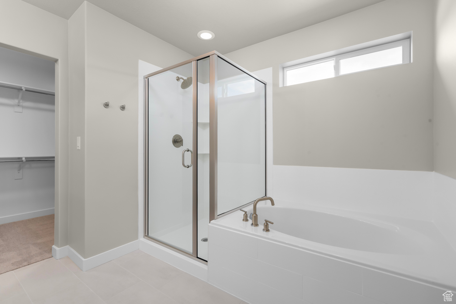 Bathroom with separate shower and tub and tile floors
