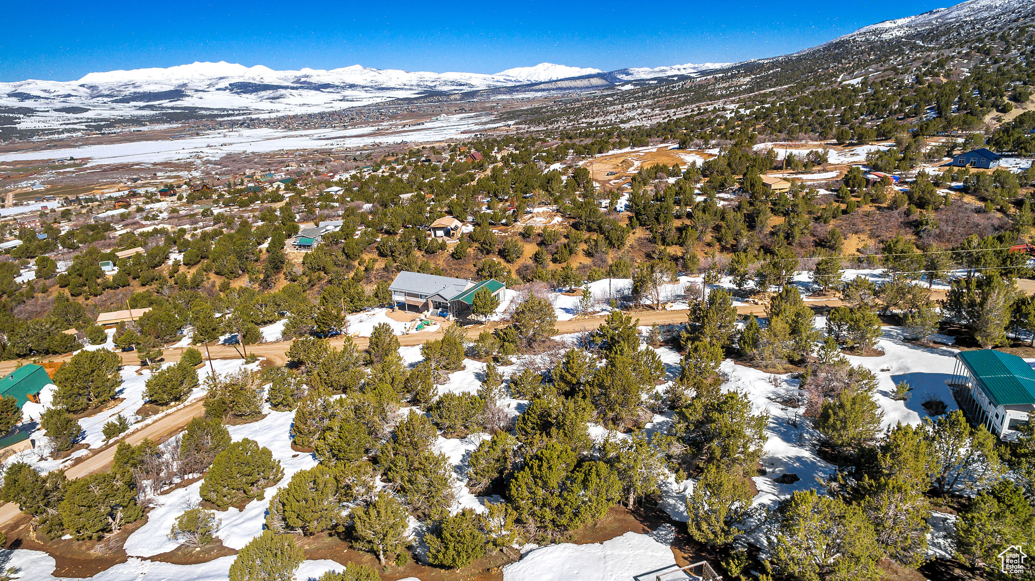 Snowy aerial view with a mountain view