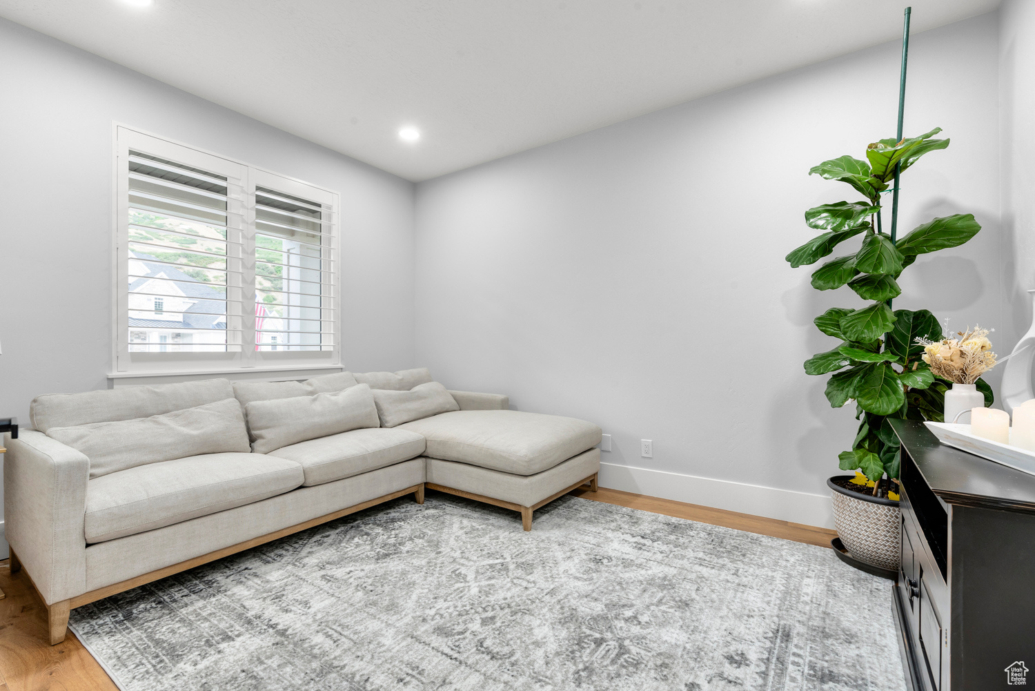 Living room with light hardwood / wood-style floors