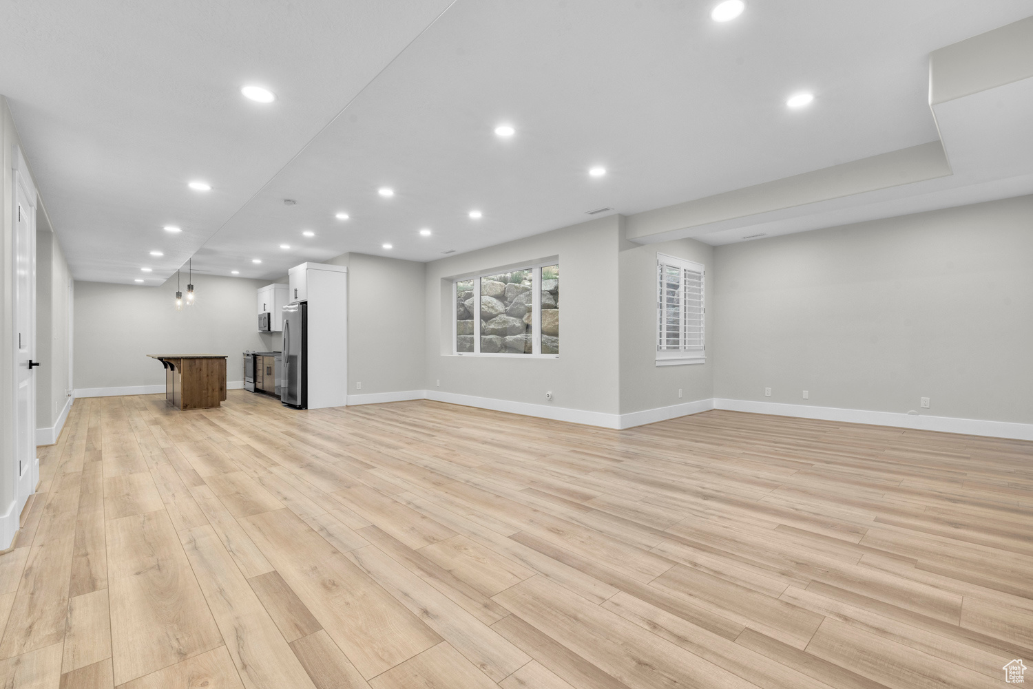 Unfurnished living room featuring light hardwood / wood-style floors