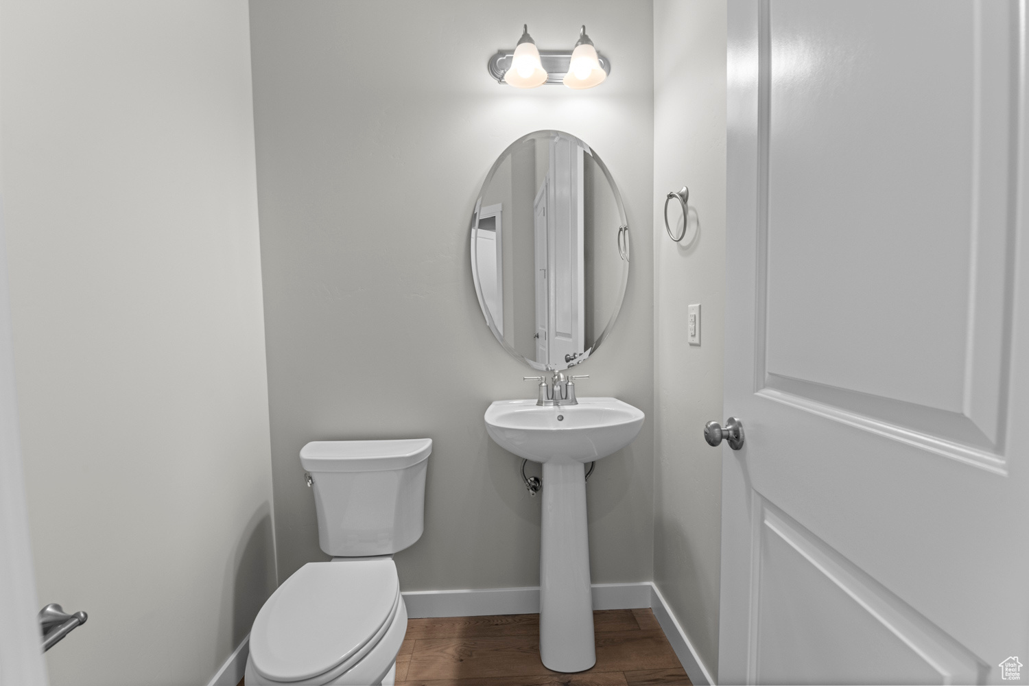 Bathroom featuring toilet and hardwood / wood-style flooring