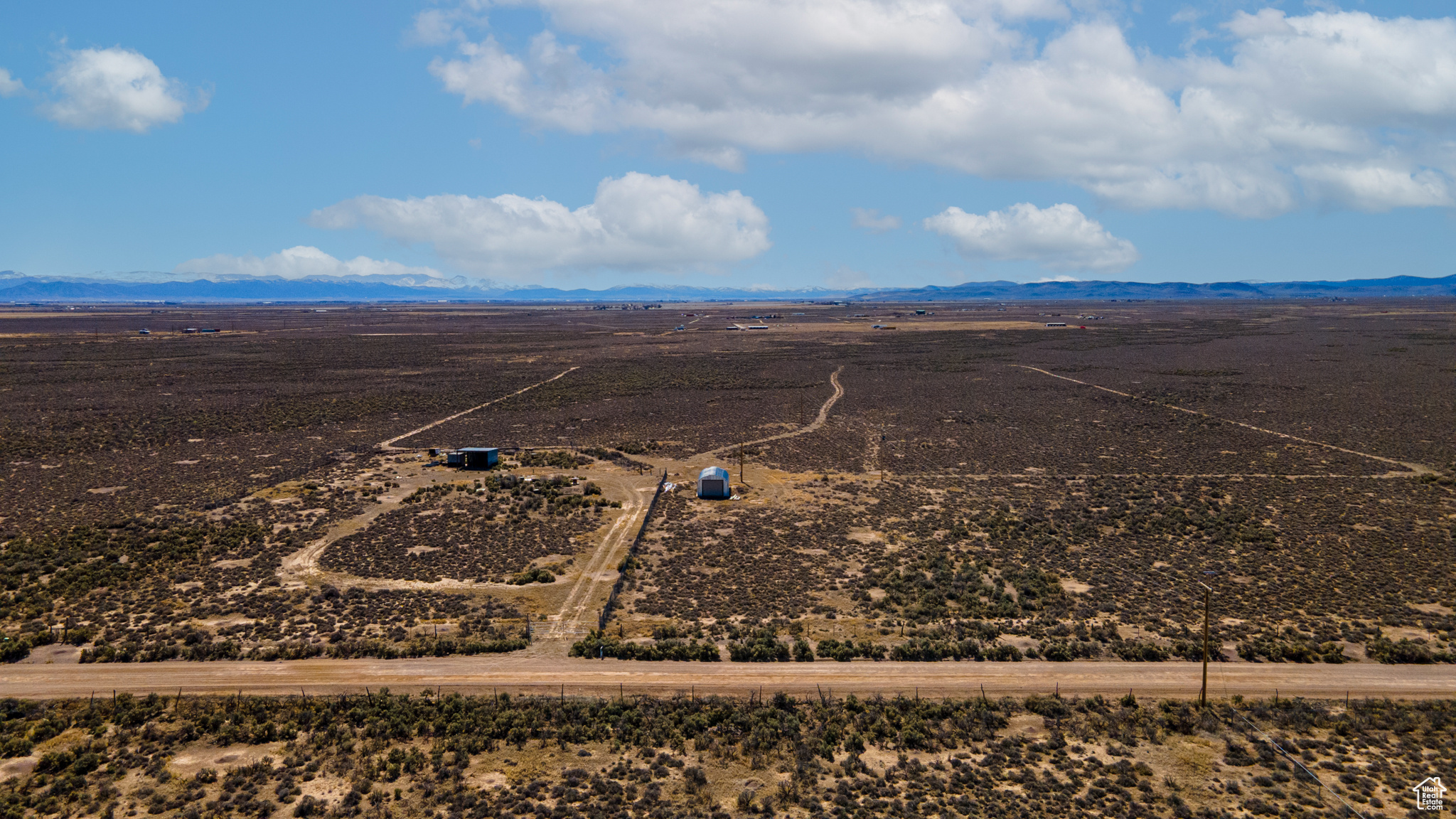 Birds eye view of property featuring a rural view