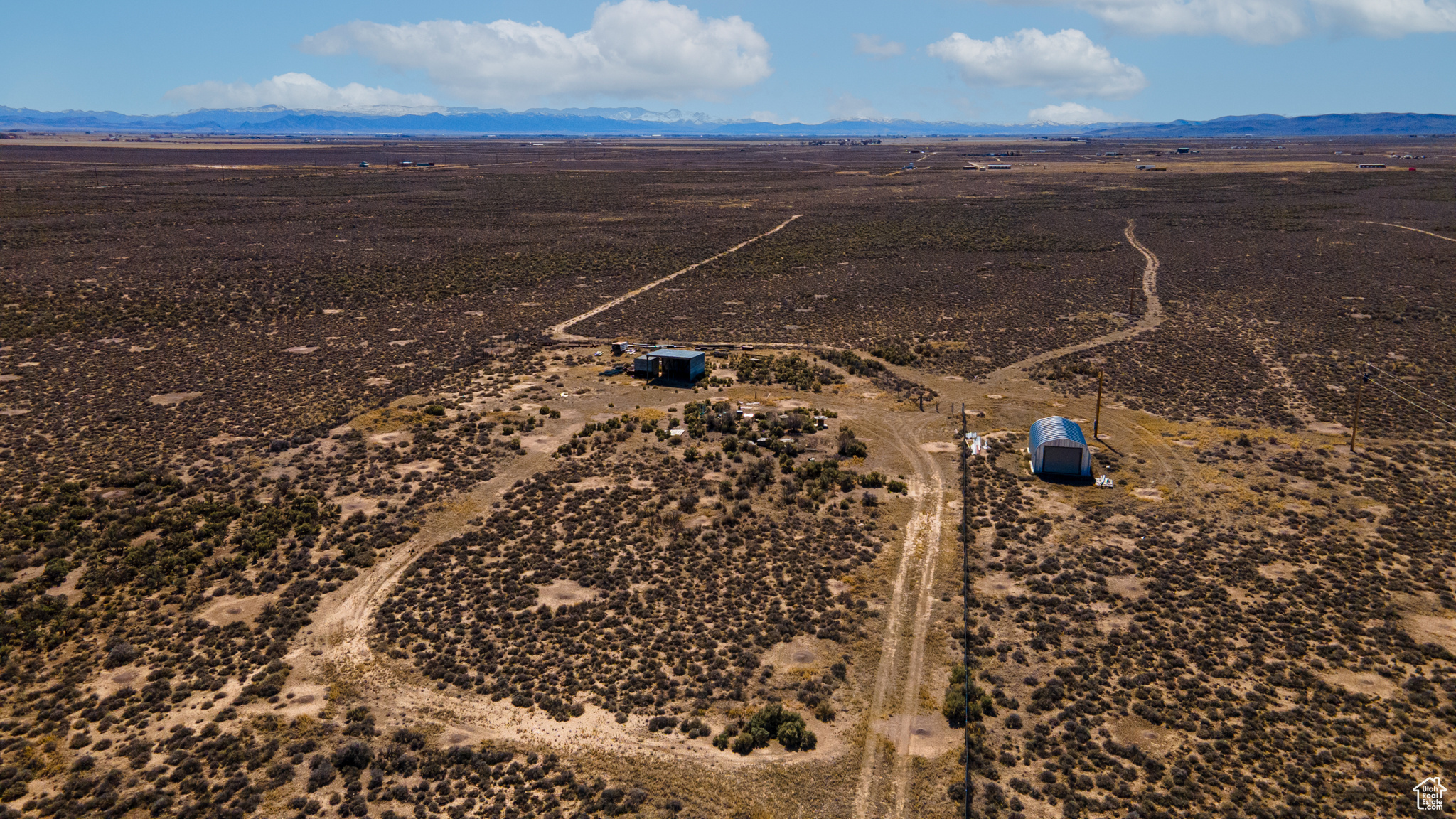 Birds eye view of property featuring a mountain view and a rural view