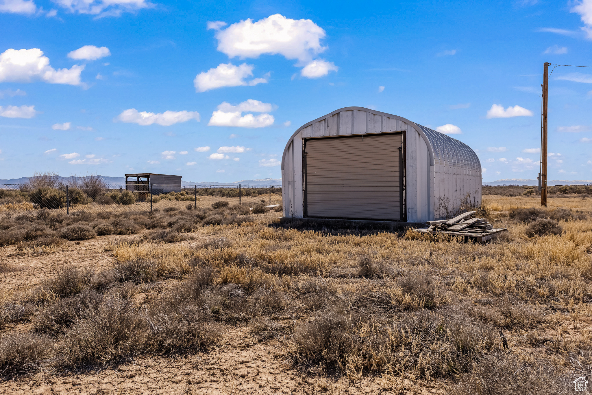 View of shed / structure with a rural view