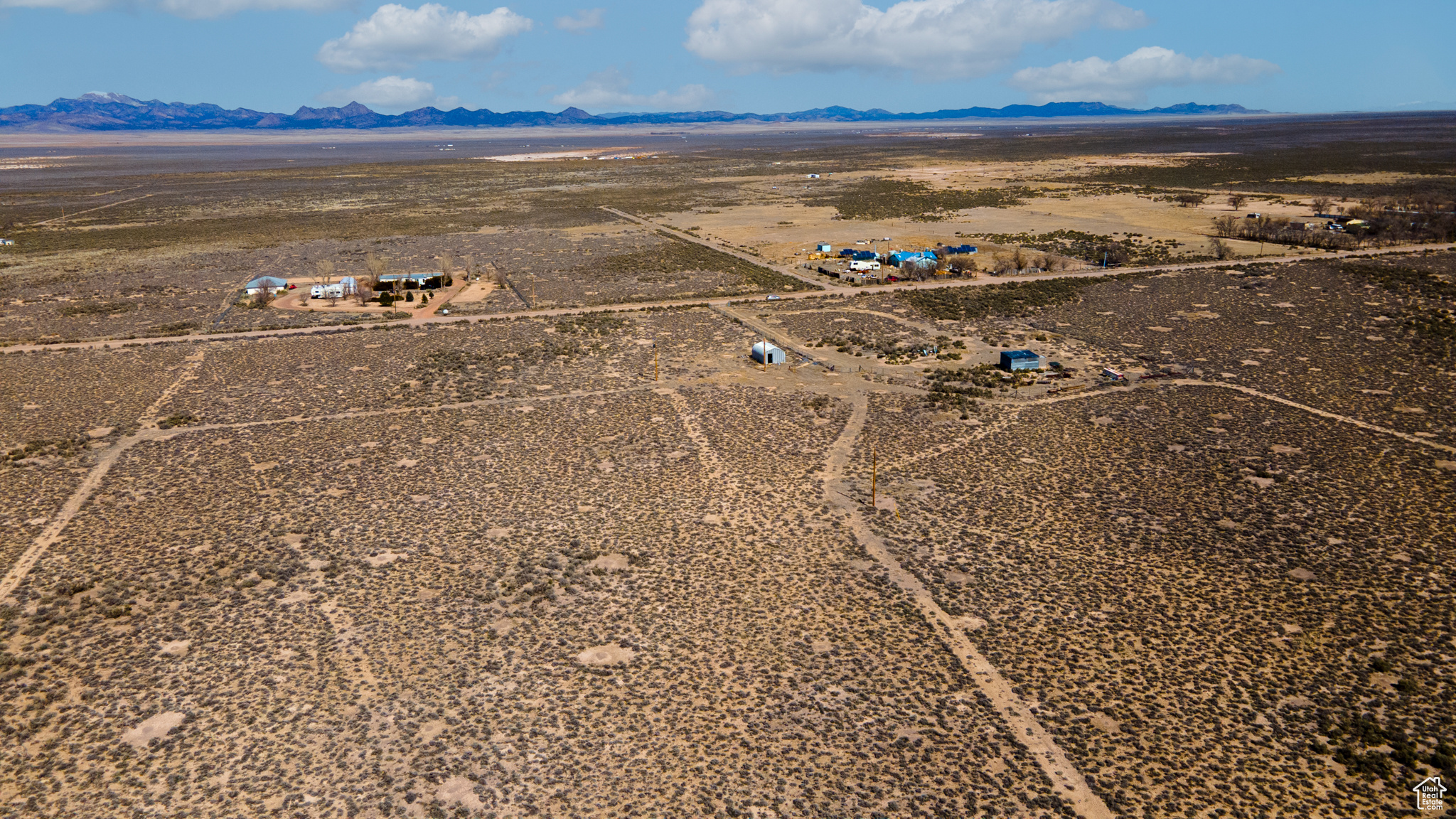 Birds eye view of property featuring a mountain view and a rural view