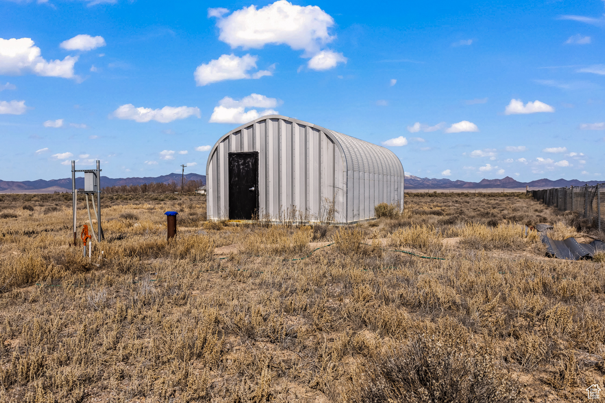 View of outdoor structure featuring a mountain view and a rural view