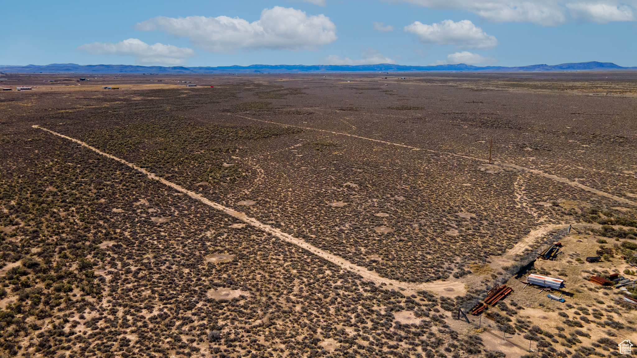 Birds eye view of property with a mountain view and a rural view