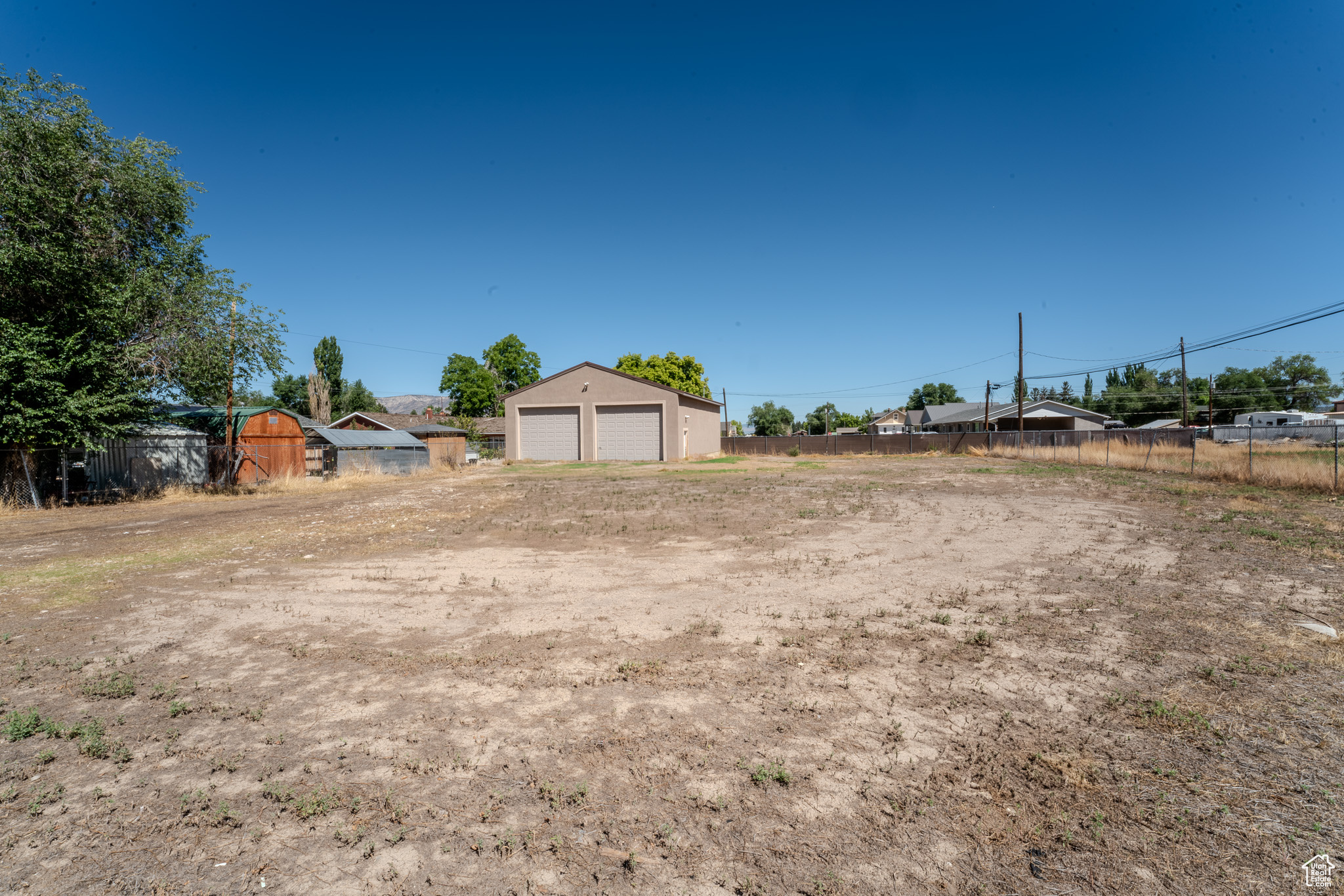 View of yard featuring an outbuilding and a garage