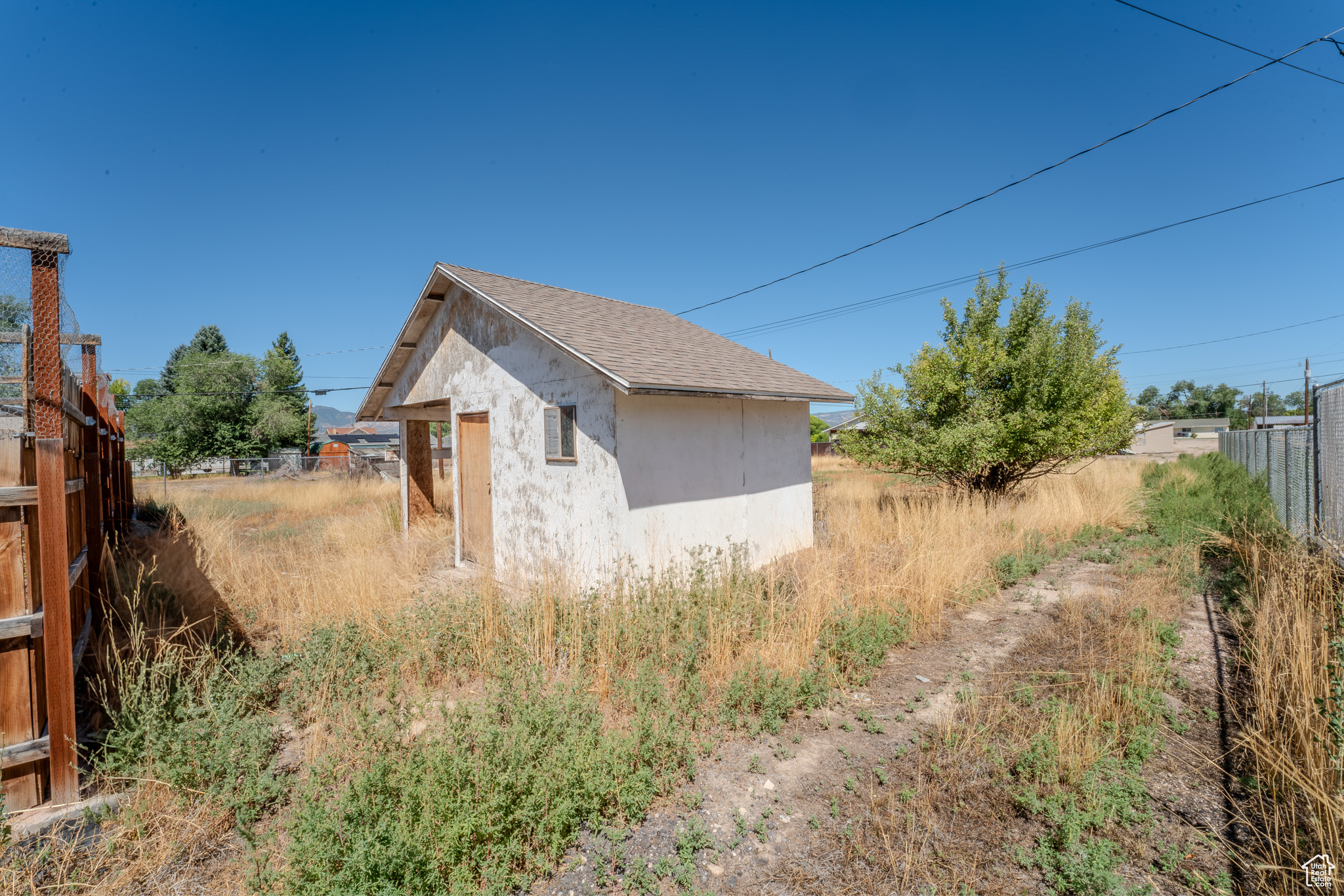 View of side of home with an outbuilding