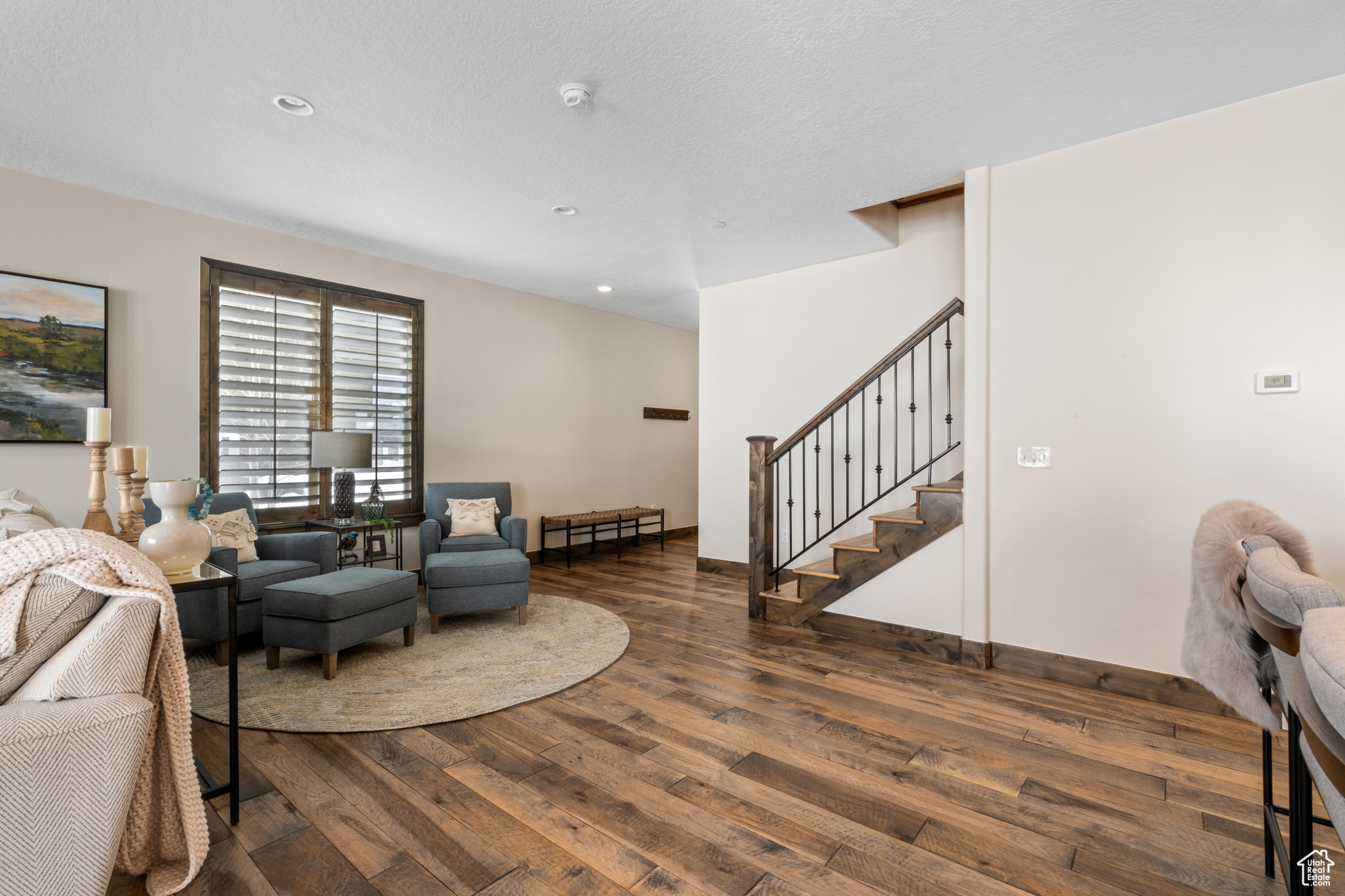 Living room with dark hardwood / wood-style floors