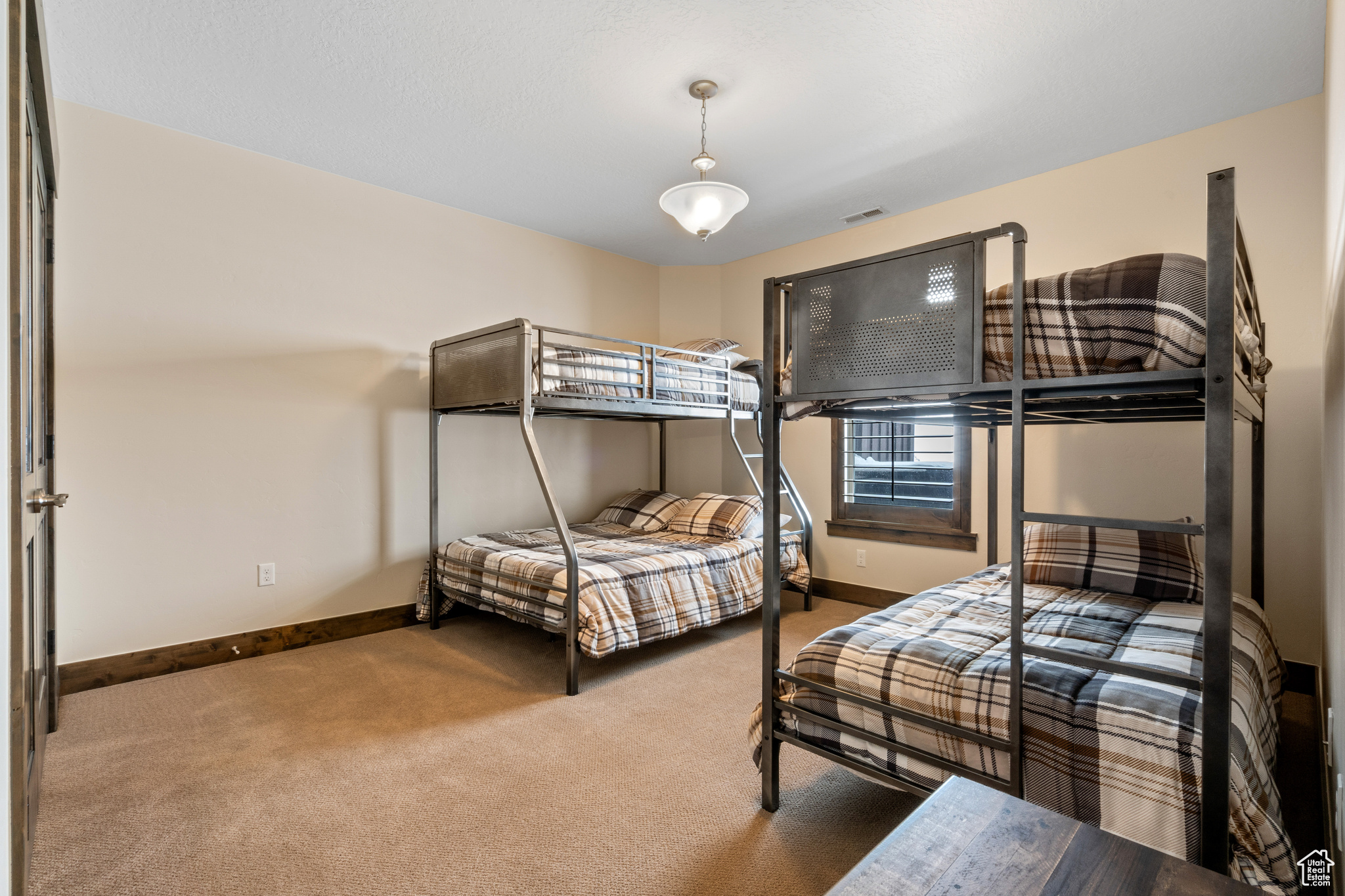 Bedroom featuring dark colored carpet