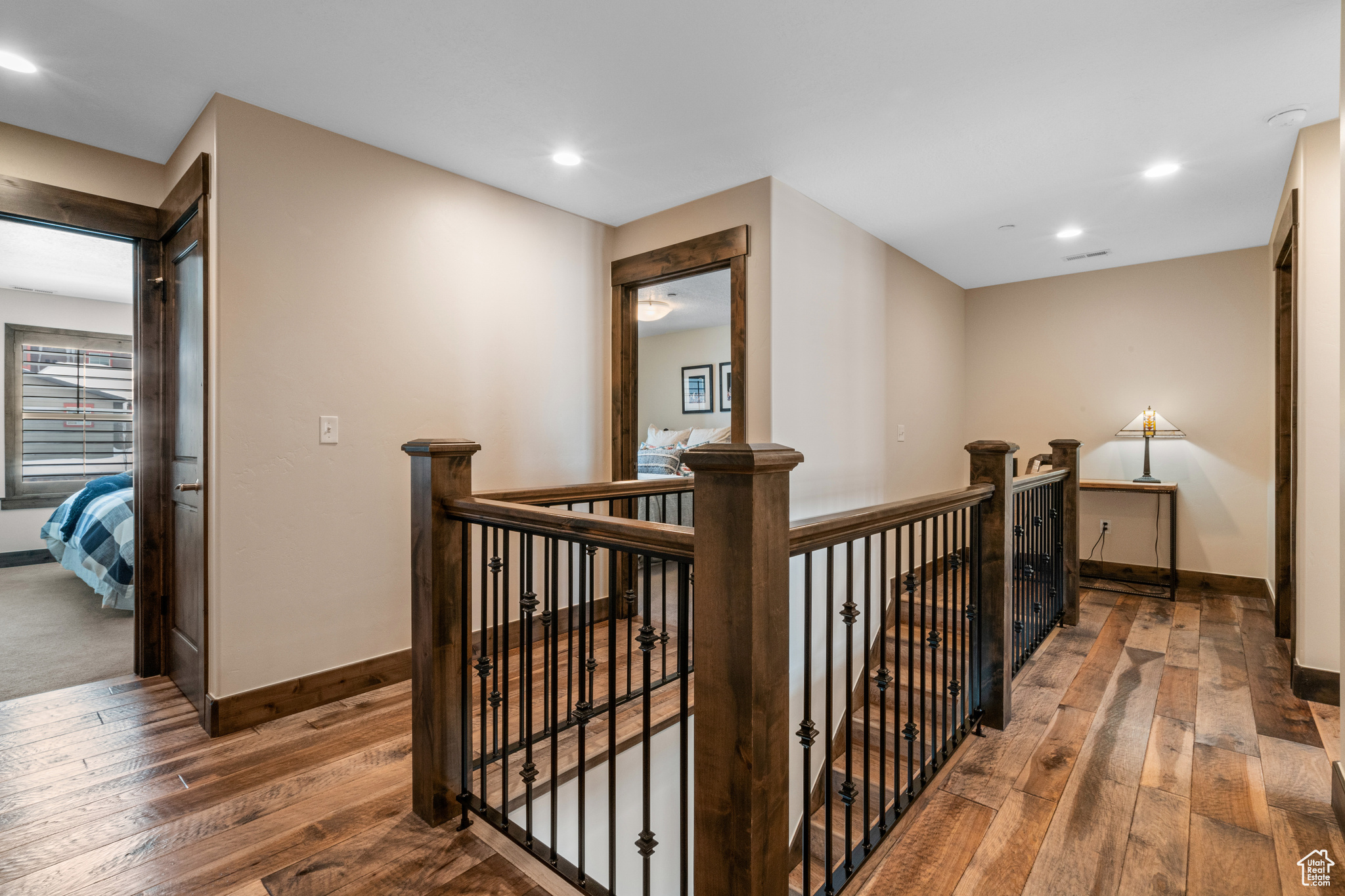 Corridor featuring dark hardwood / wood-style floors