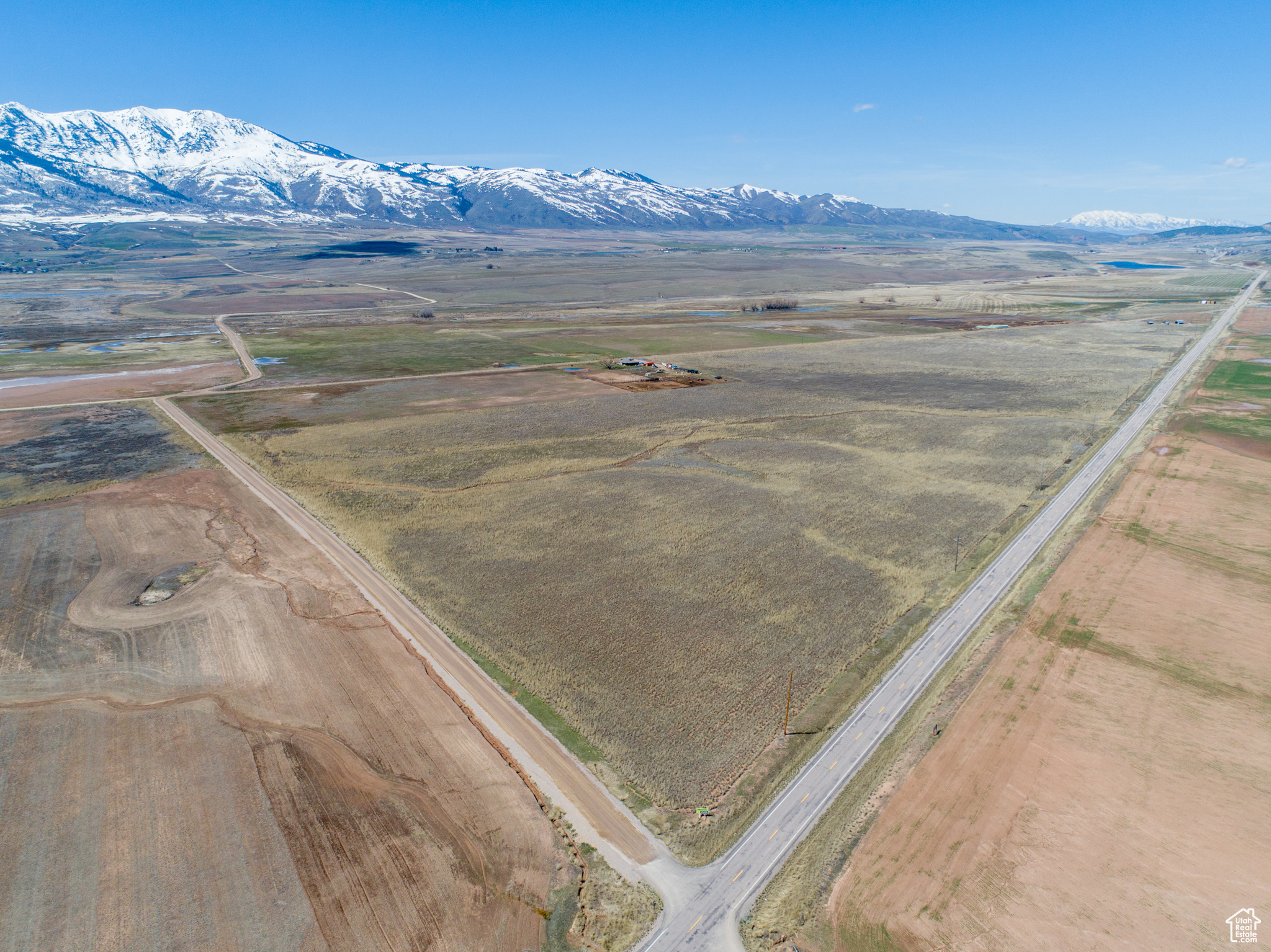 Birds eye view of property featuring a mountain view and a rural view