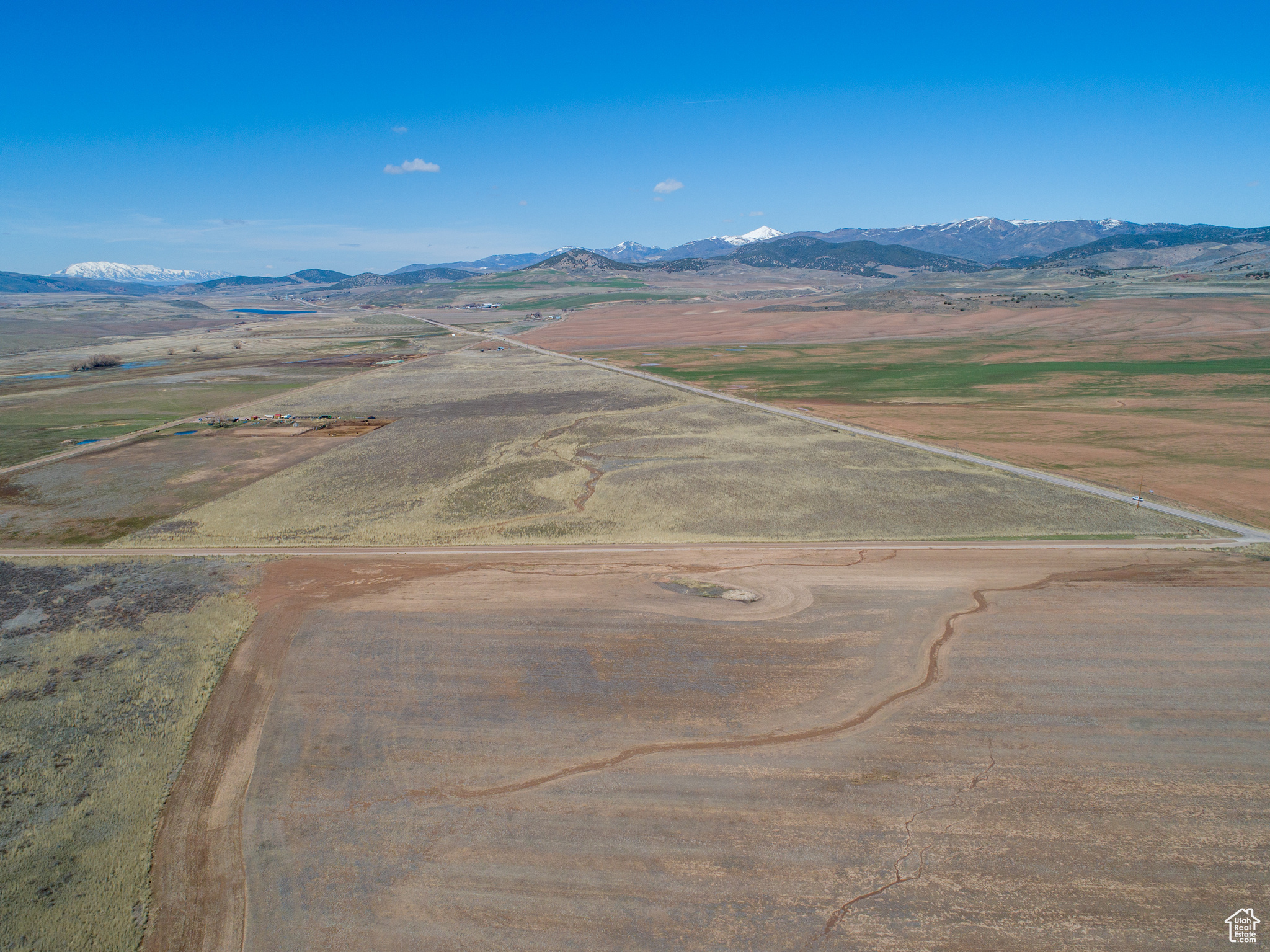 Birds eye view of property with a mountain view and a rural view