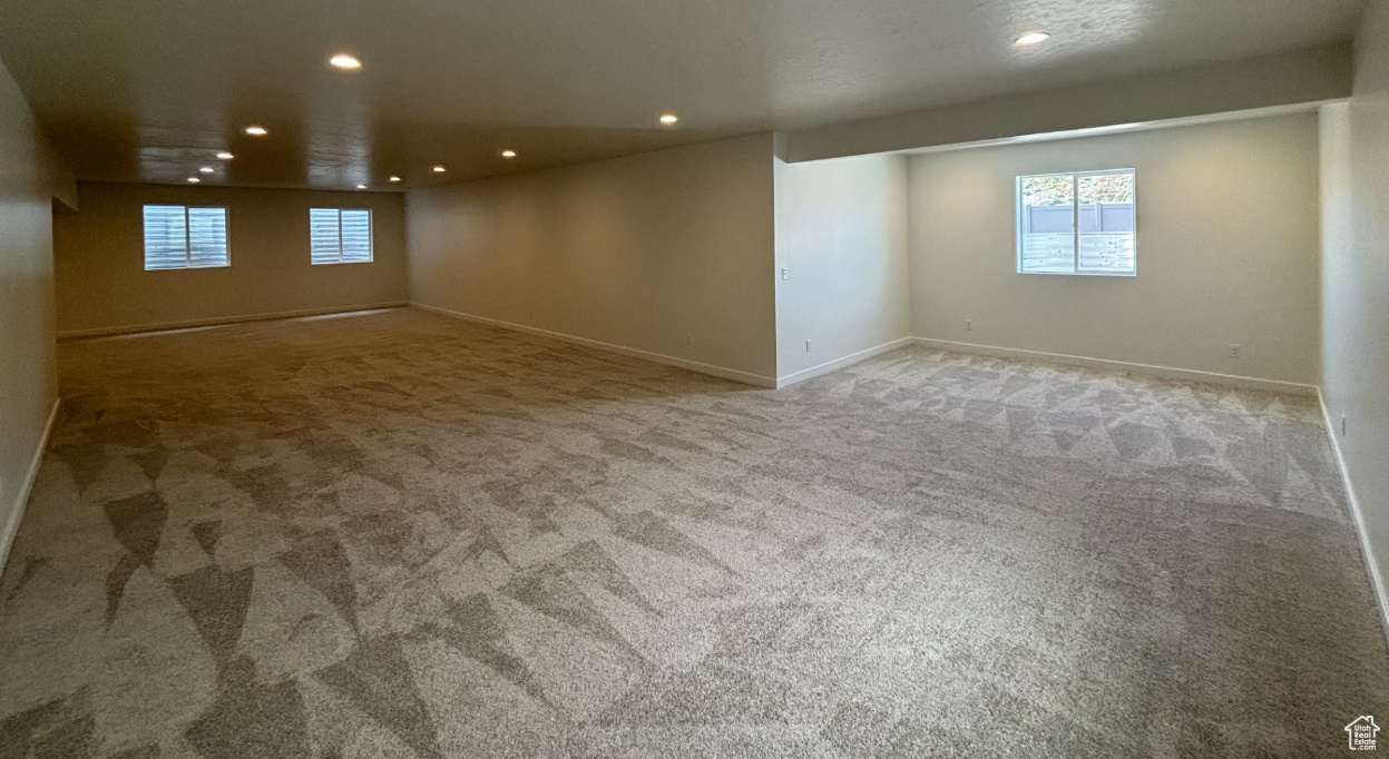 Unfurnished room featuring carpet flooring
