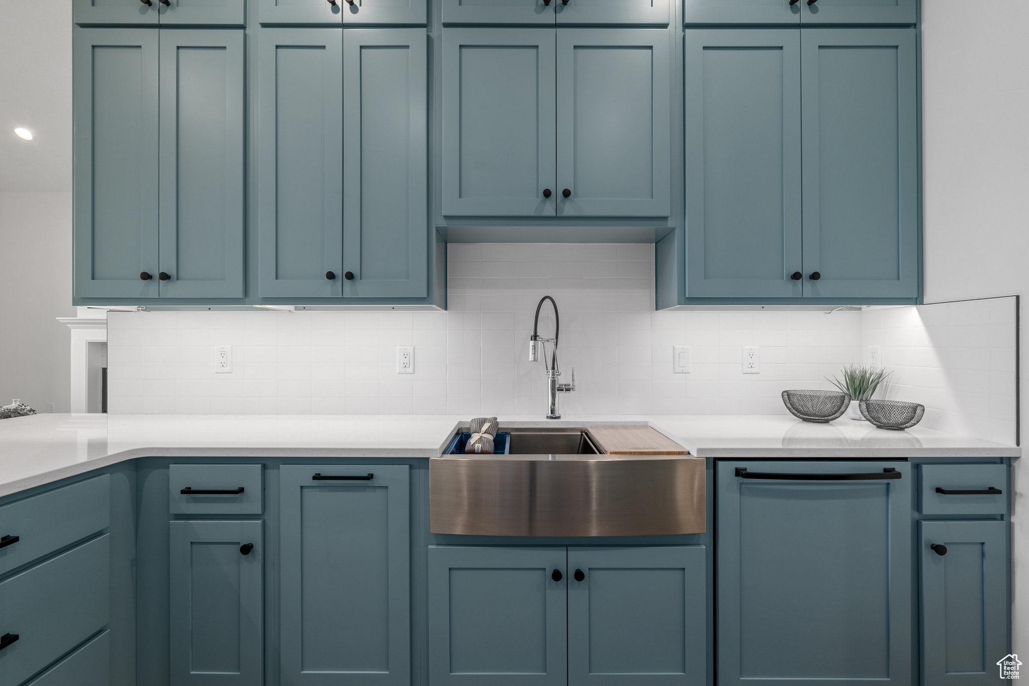 Kitchen with backsplash, sink, and dishwasher