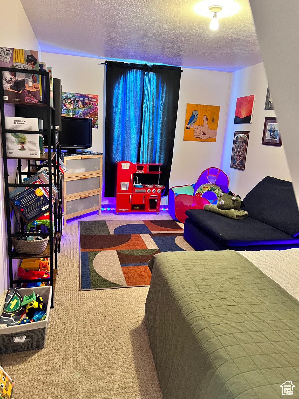 Attic storage room being used as an extra bedroom