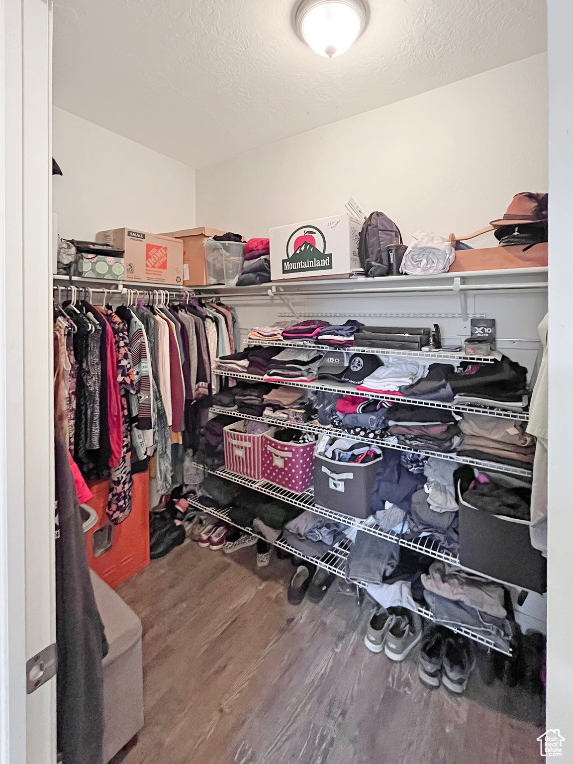 Spacious Master walk-in closet with shelves