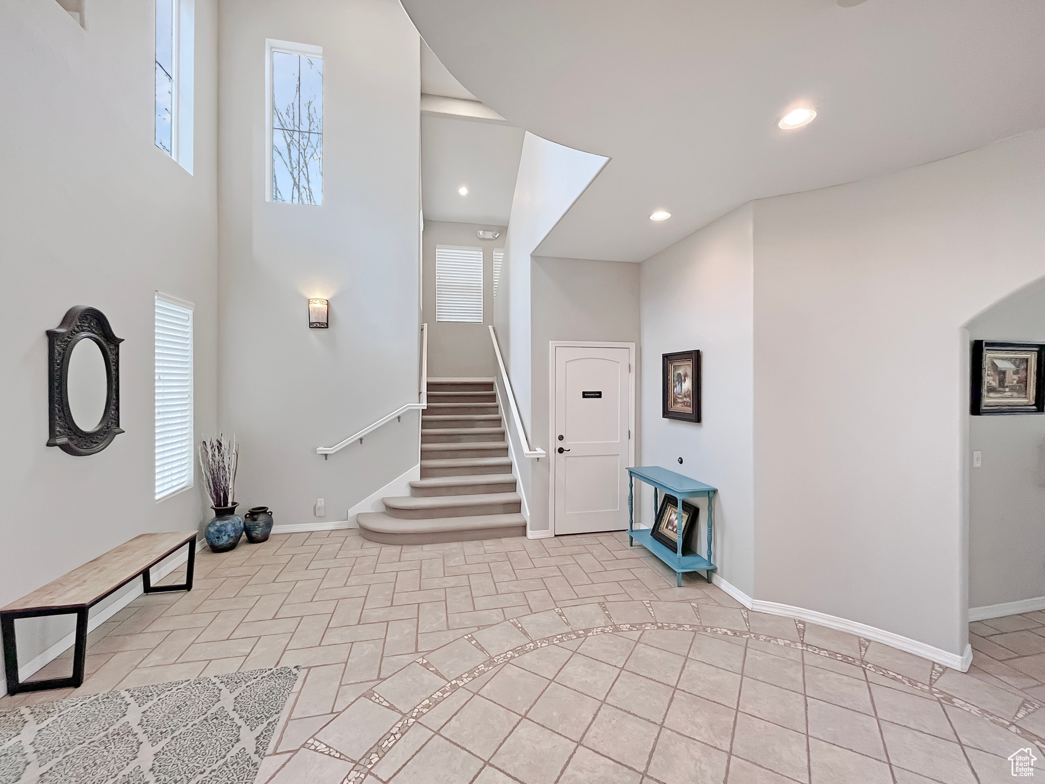 Beautiful community center entrance foyer with beautiful tile flooring and towering ceilings