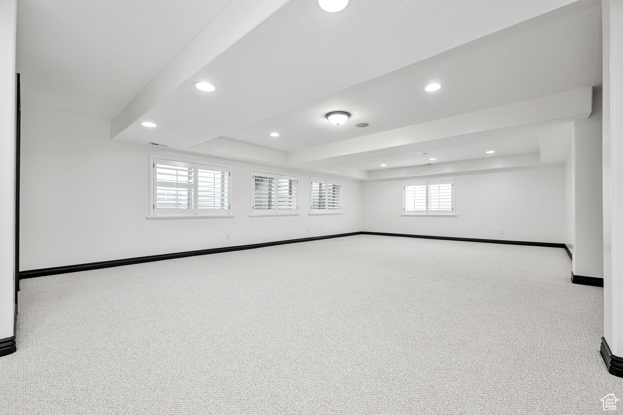 Large Family room featuring carpet, a closet, and a ceiling fan