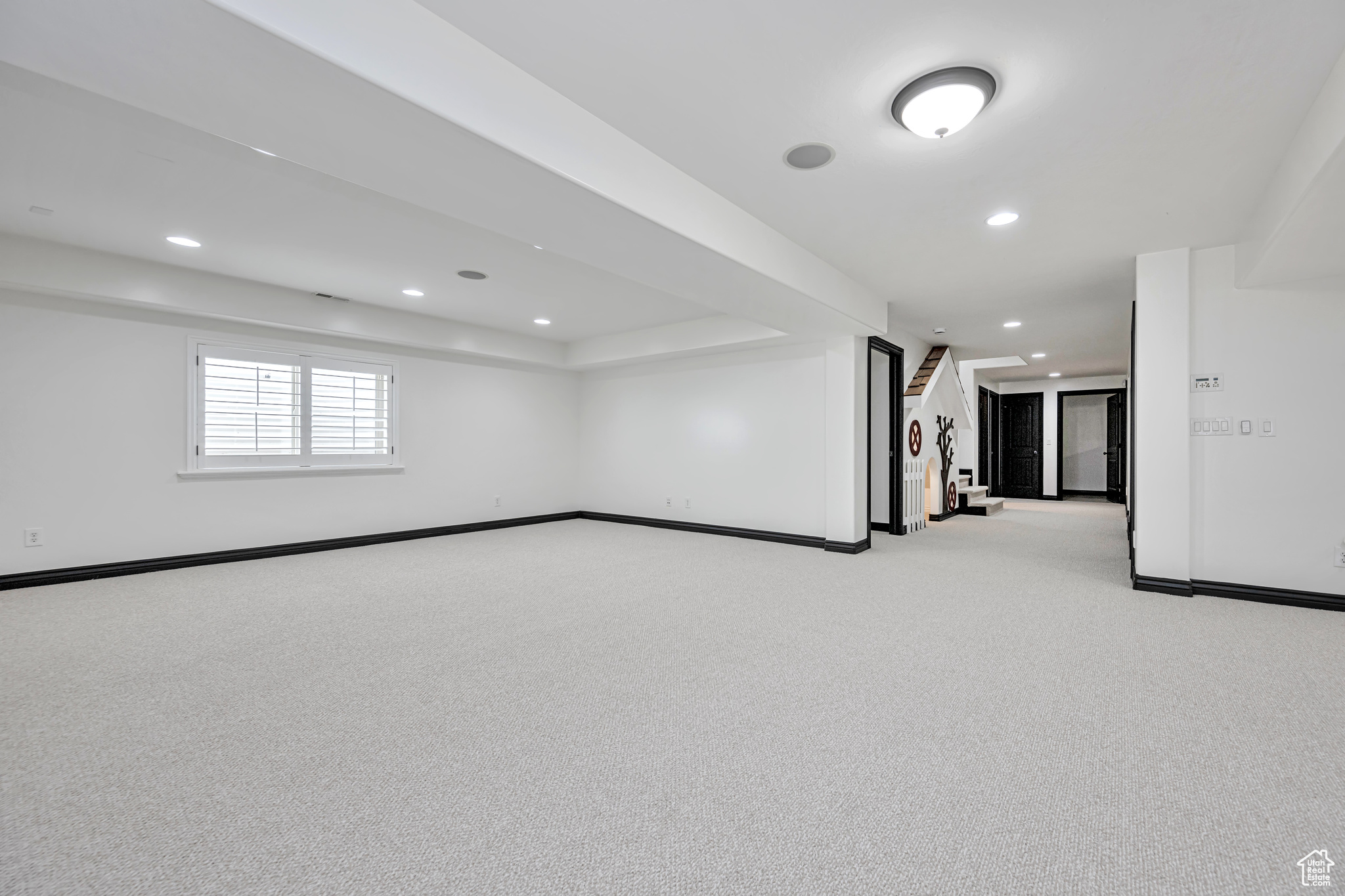 Large Family Room featuring carpet, a closet, and a ceiling fan and indoor play house