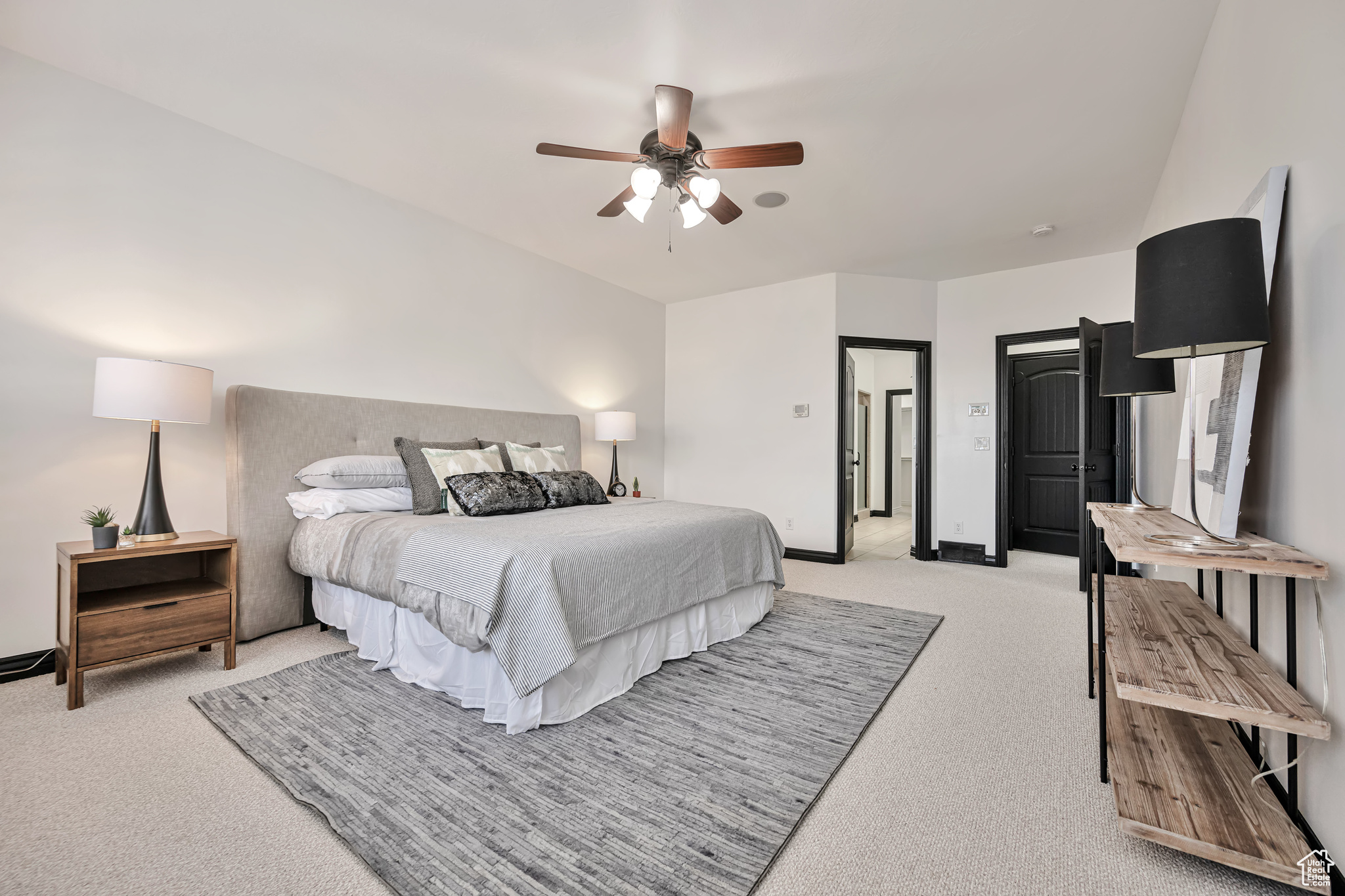 Large Principal Bedroom 1 featuring light colored carpet and ceiling fan, own bathroom and walk-in closet