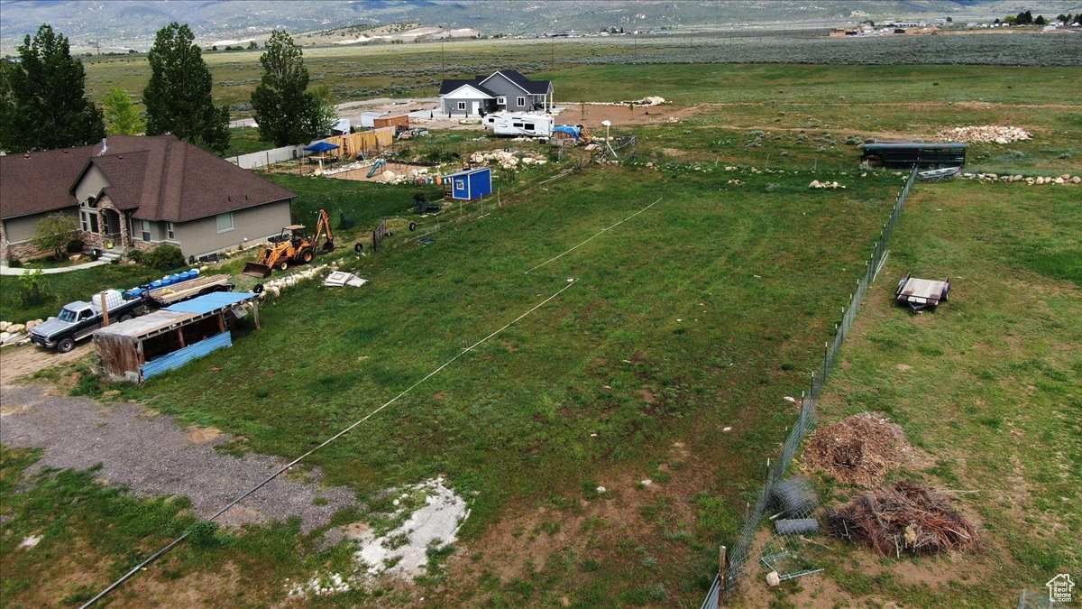 Birds eye view of property featuring a rural view