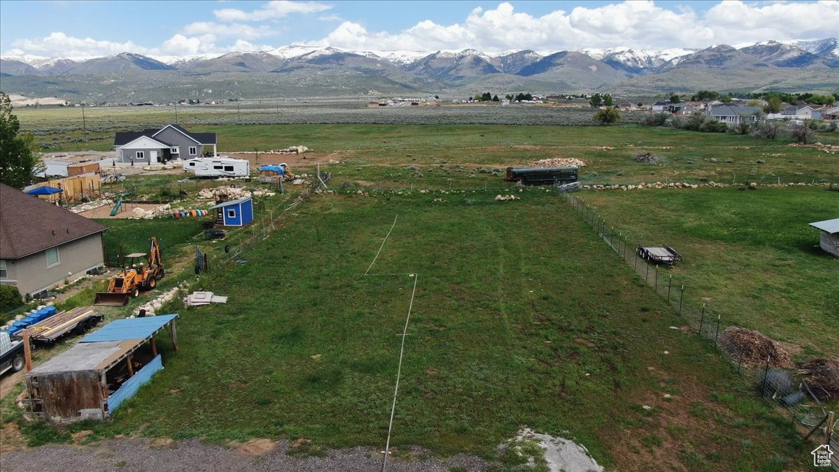 Aerial view featuring a rural view and a mountain view