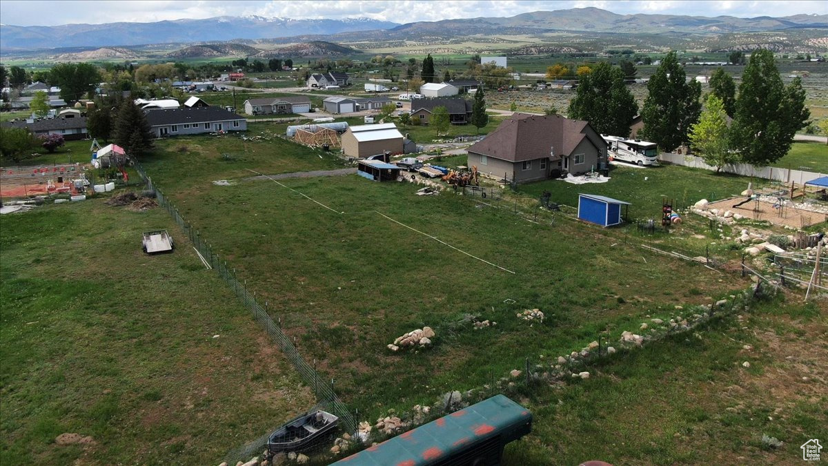 Birds eye view of property with a mountain view