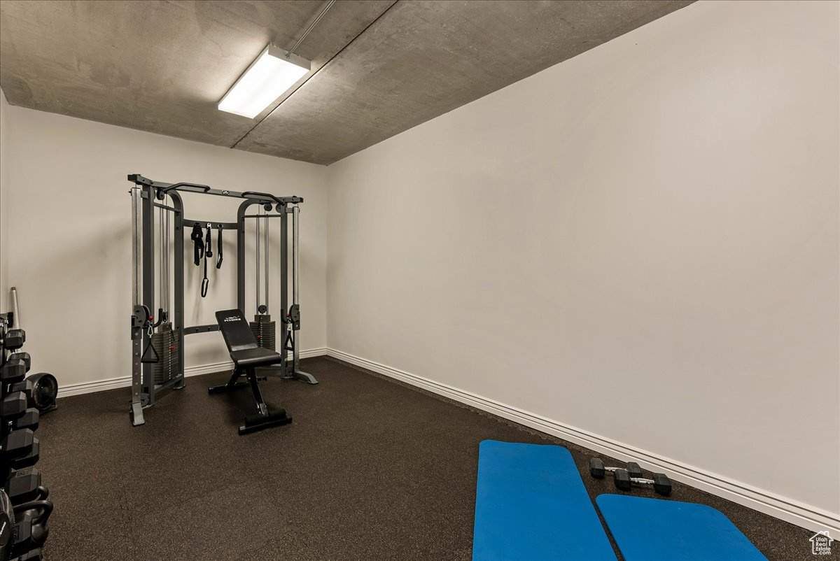 Exercise room with dark carpet