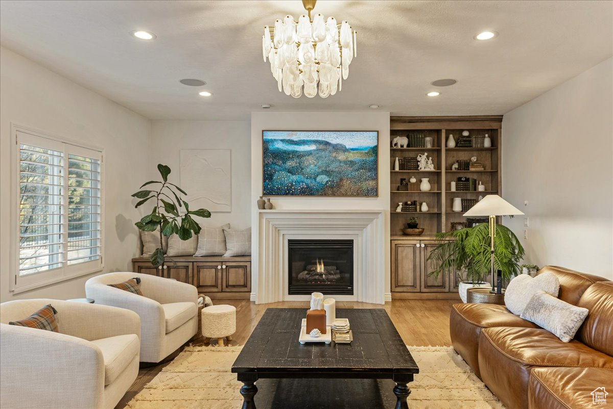 Living room featuring a notable chandelier and light hardwood / wood-style floors