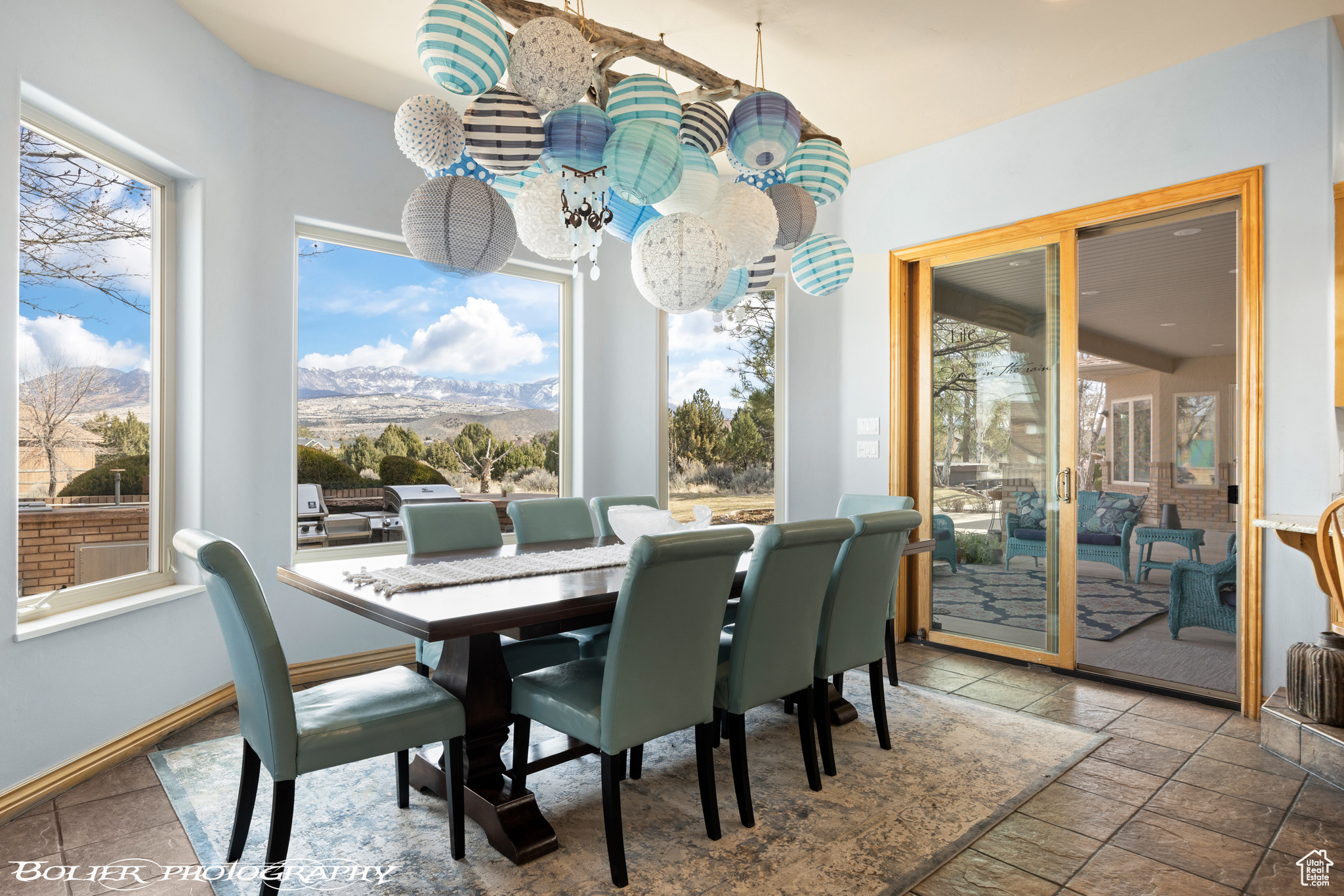 Dining space with a wealth of natural light and tile floors