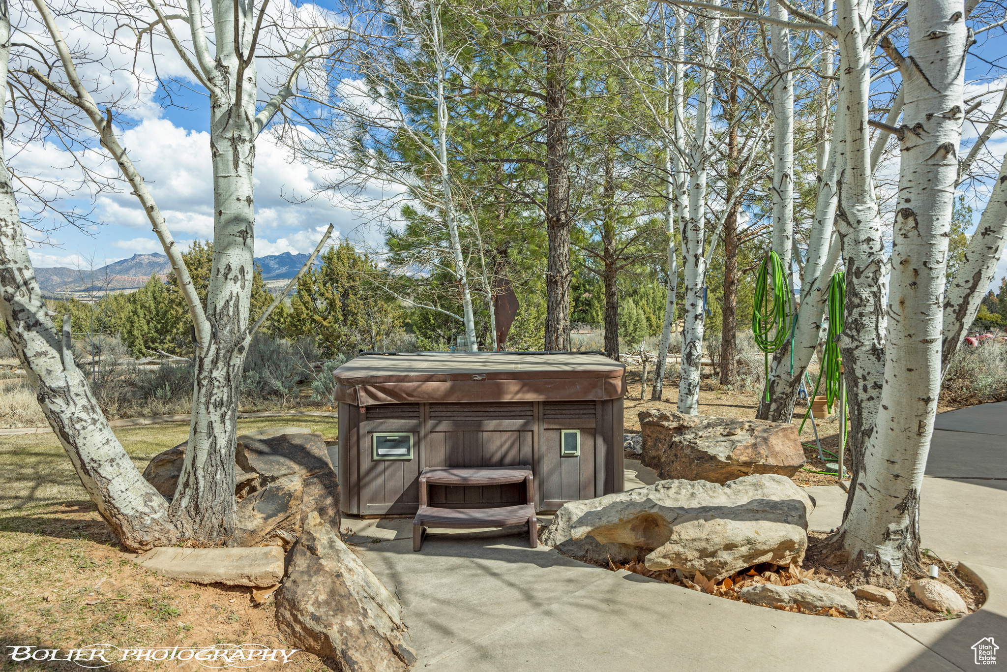 Included Hot Tub nestled in aspens.