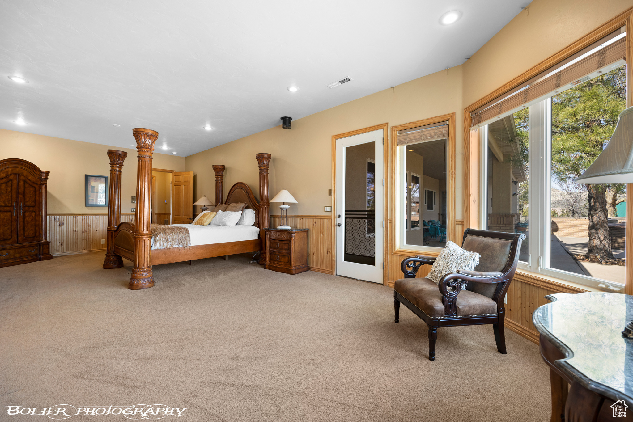 Carpeted bedroom with access to exterior