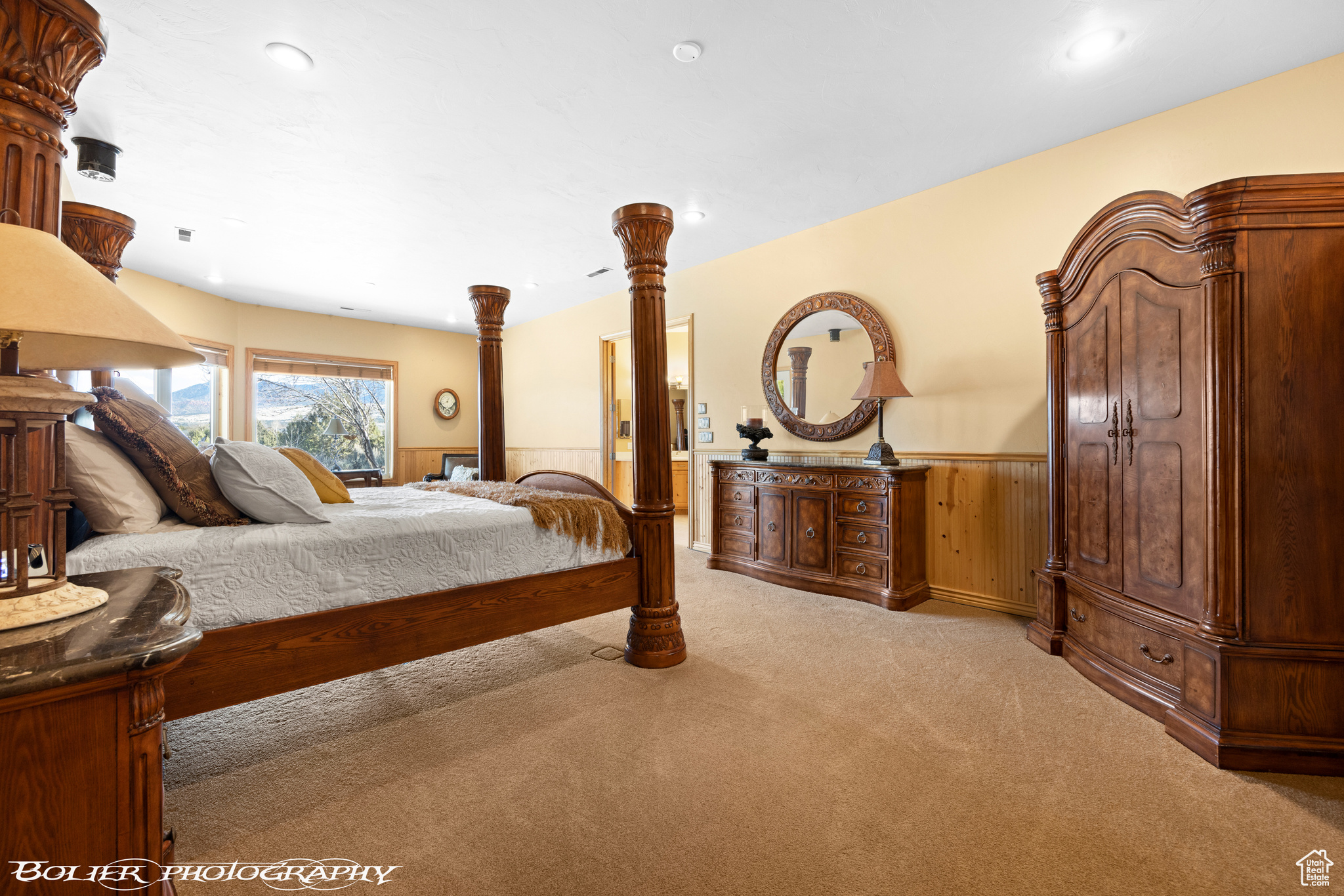 Primary Bedroom with light colored carpet