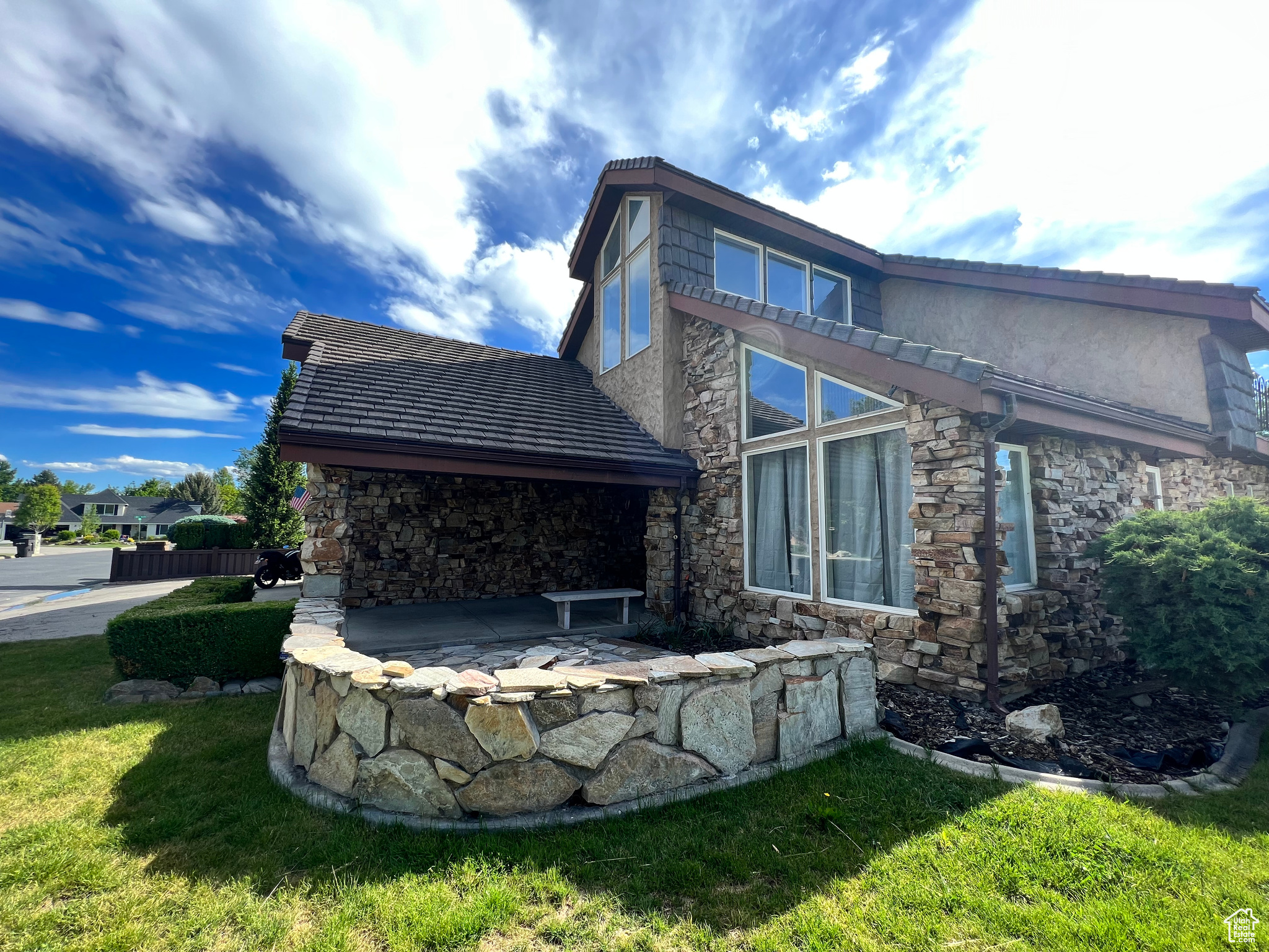 Rear view of property with a lawn