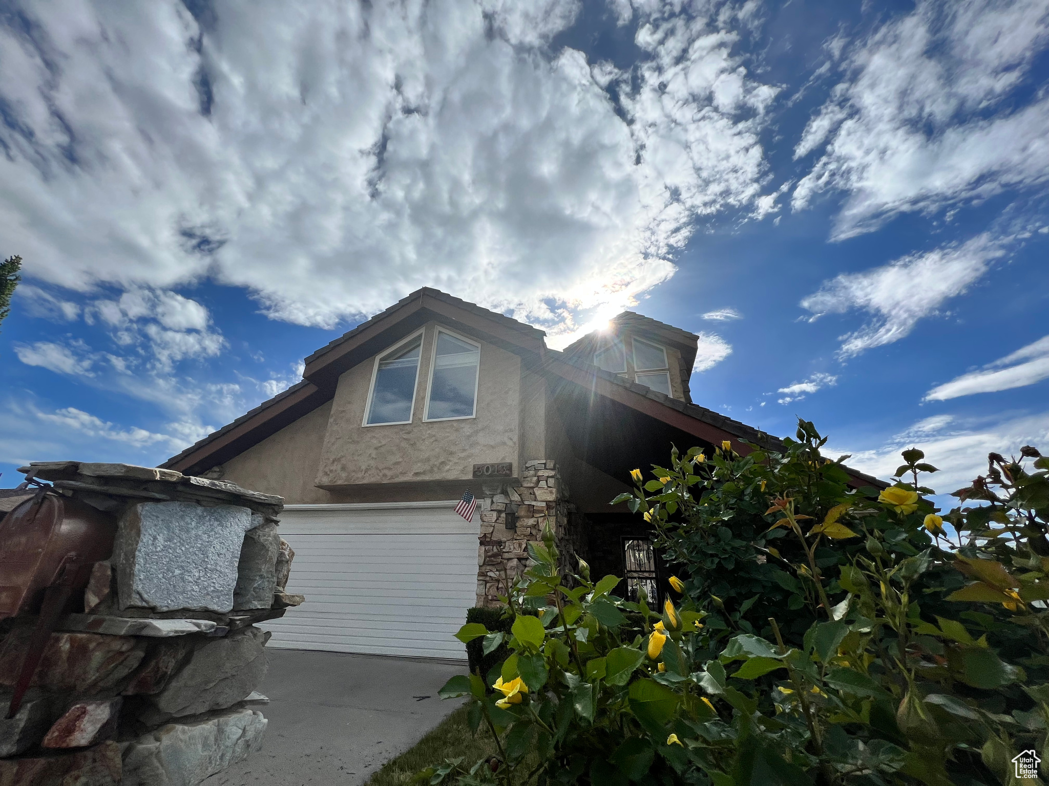 View of front facade featuring a garage