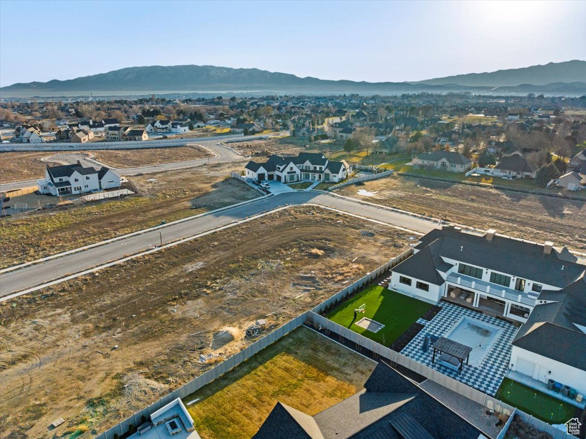 Drone / aerial view featuring a mountain and lake view