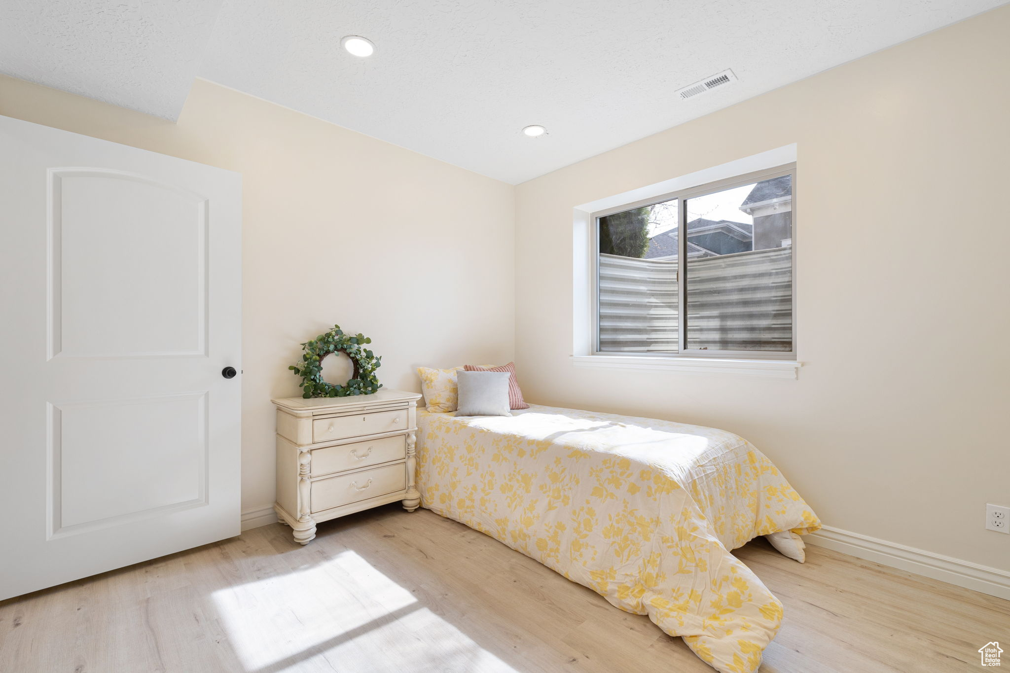 1 of 2 basement apatment / flex area - Bedroom featuring light hardwood / wood-style floors