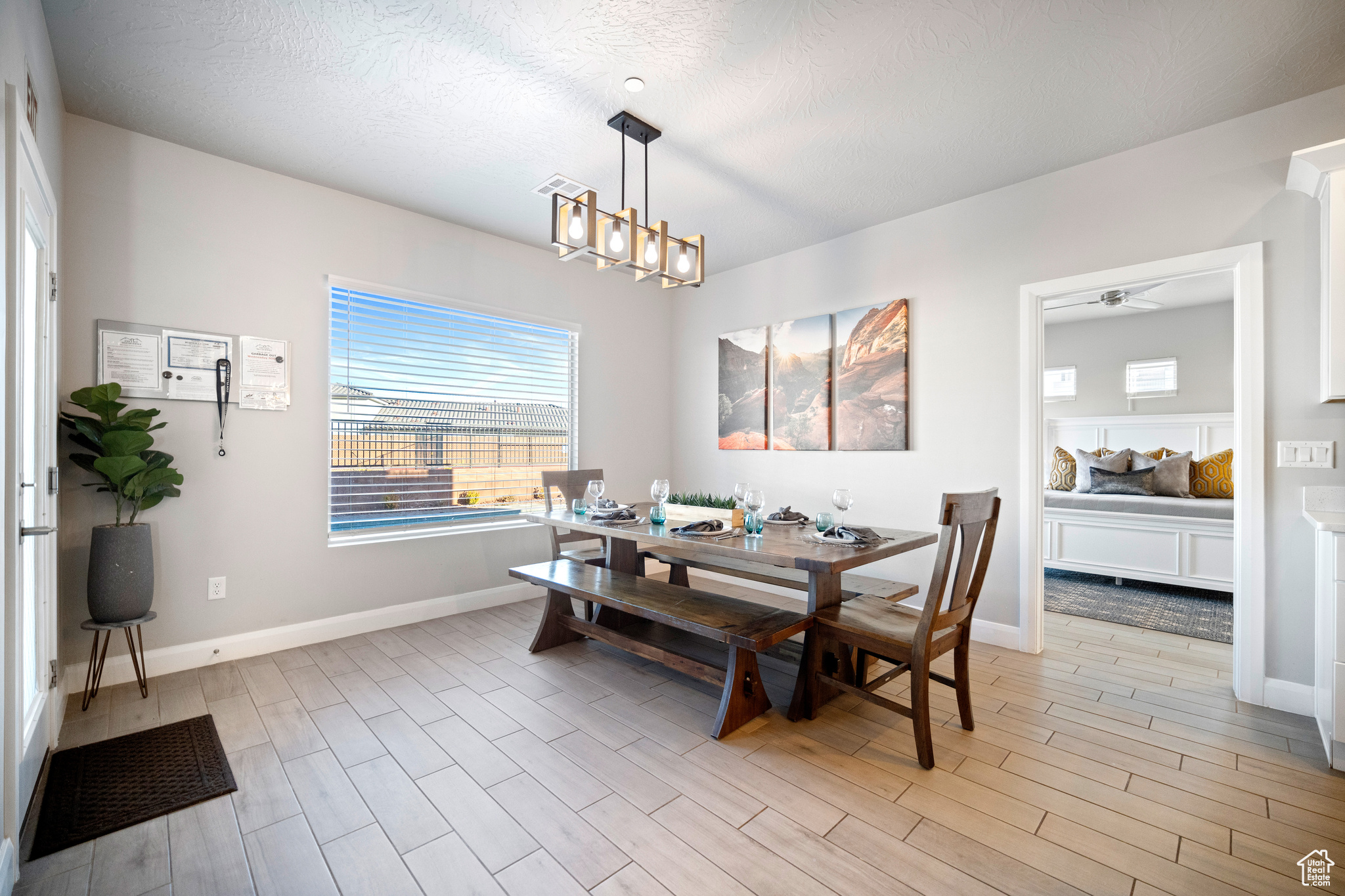 Dining room with beautiful view of the backyard.2 foldable tables and benches included in the sale to accommodate large groups. All furnitures are included.