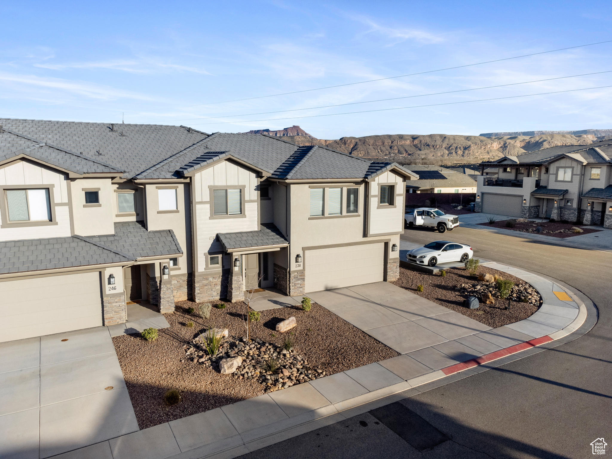 View of front of property featuring a garage and a mountain view