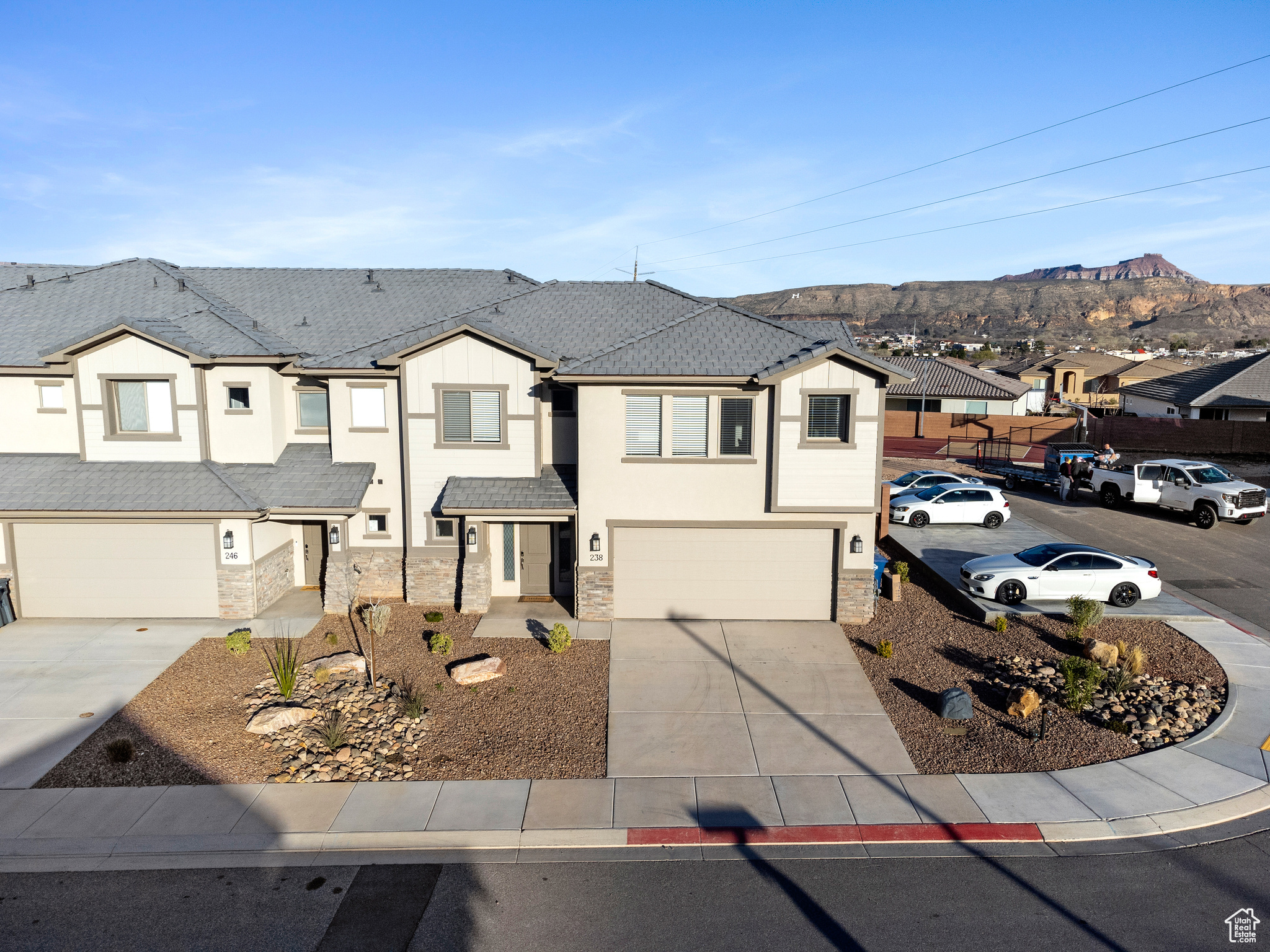 View of front of property featuring a mountain view and a garage