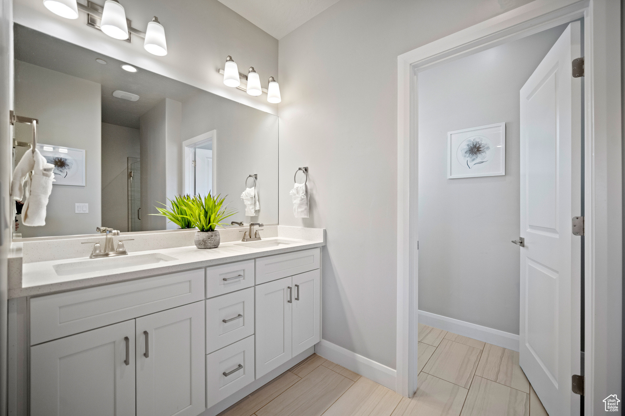 Main floor master bathroom with dual sinks.