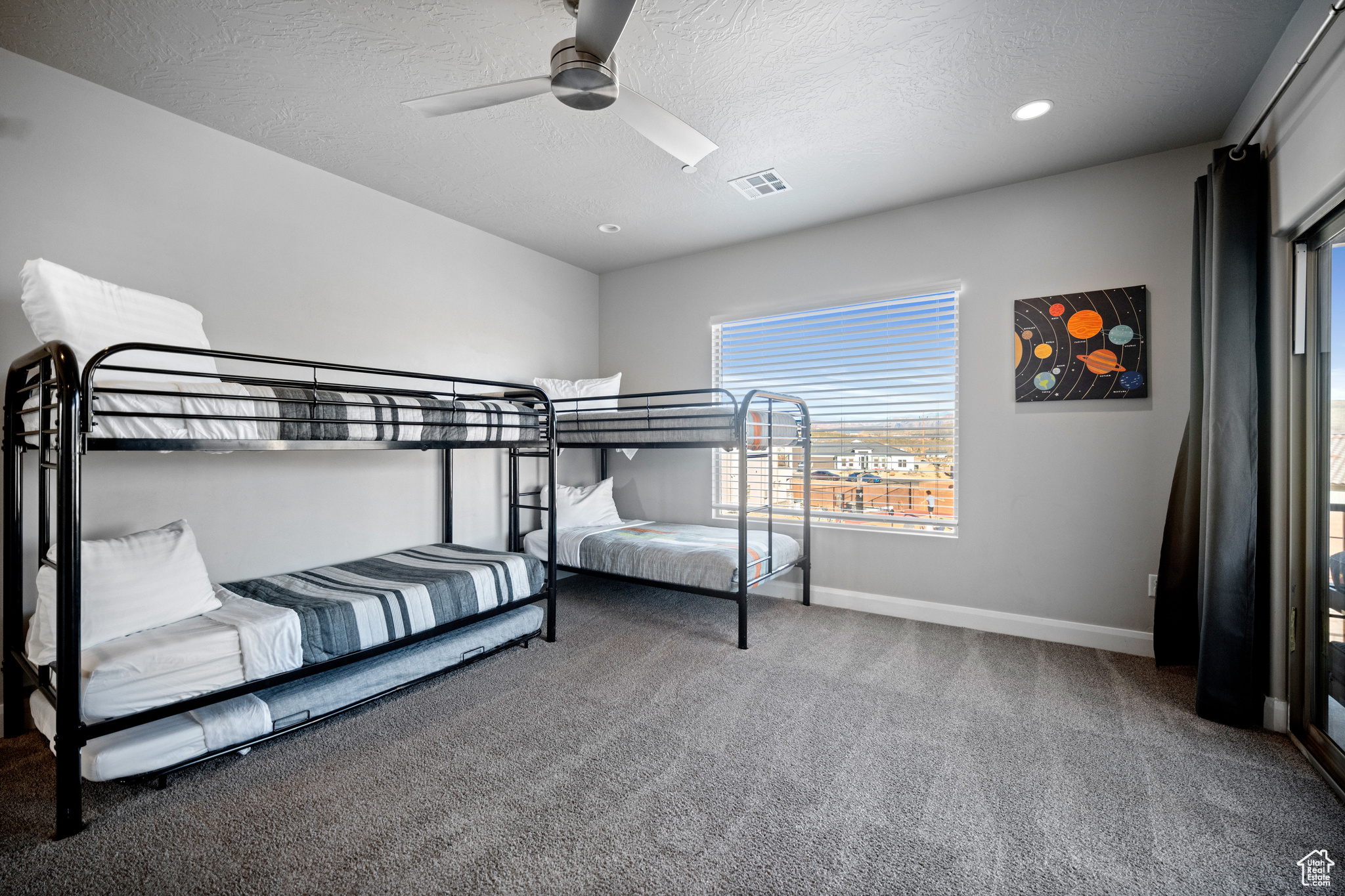 Kids bunk bedroom with 5 twin beds. Roll away memory foam twin mattresses available in the closet for extra people.