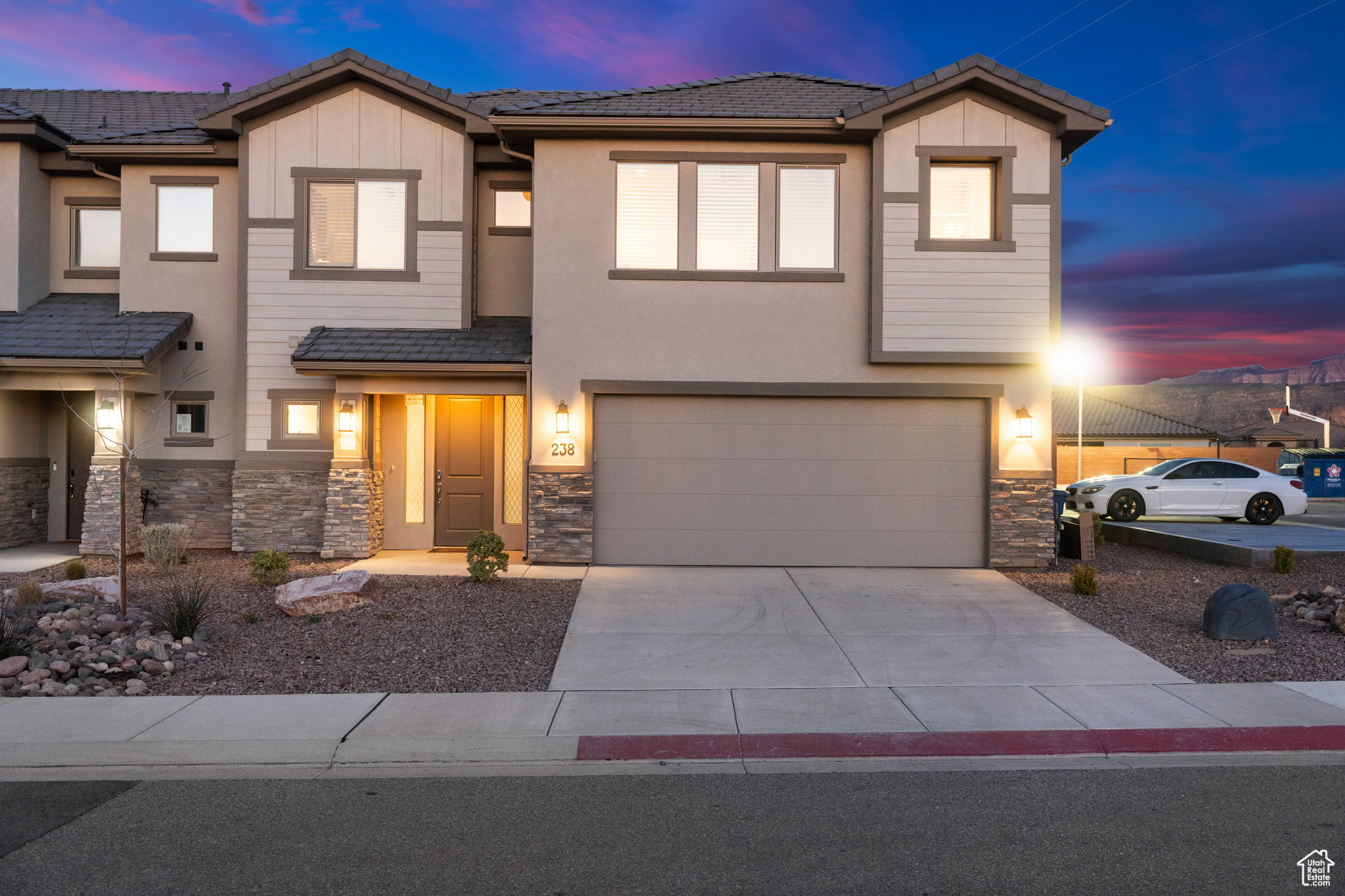 2 car garage with a driveway. Tons of extra parking right next to the driveway.