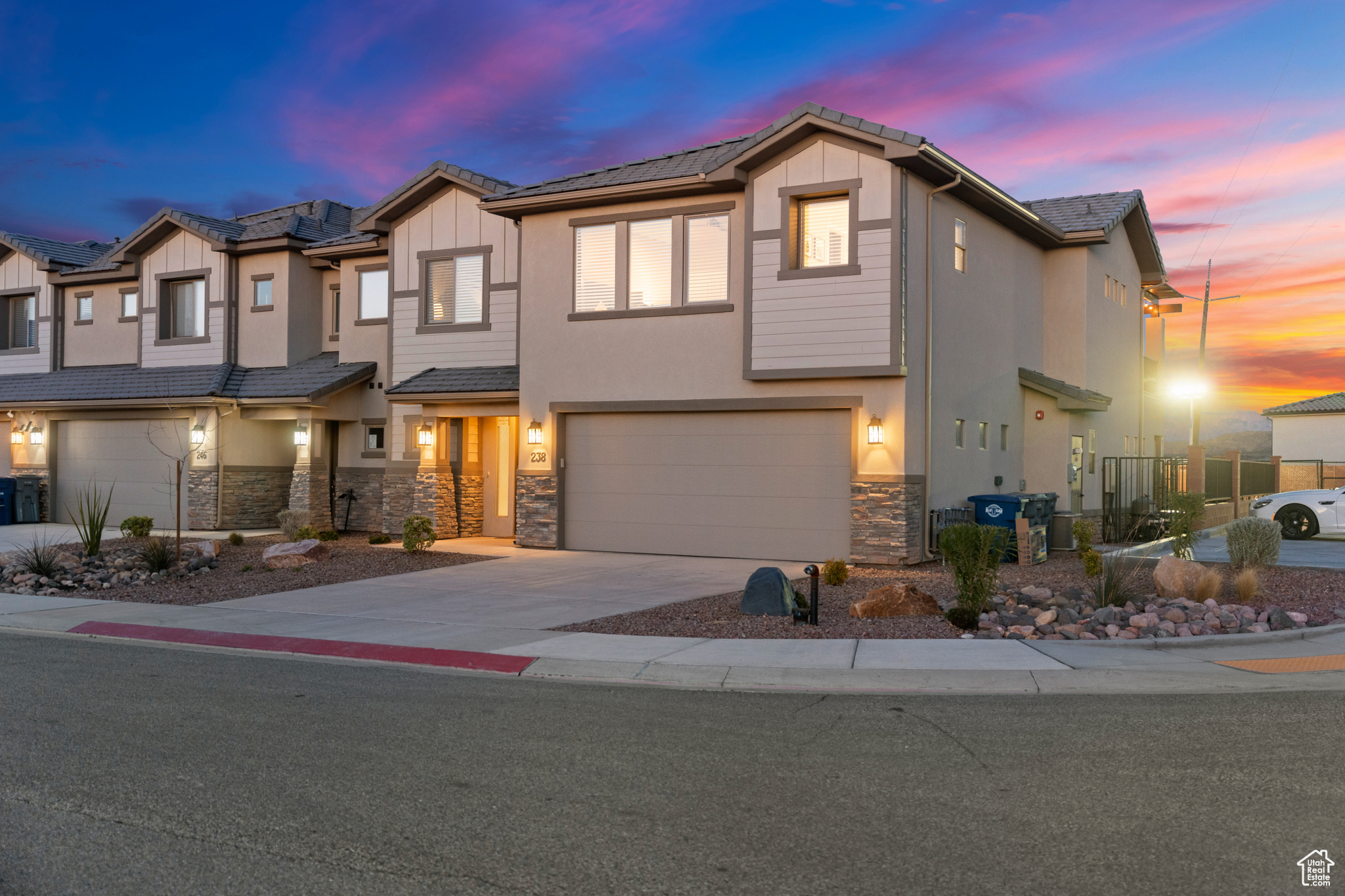 View of front facade featuring a garage