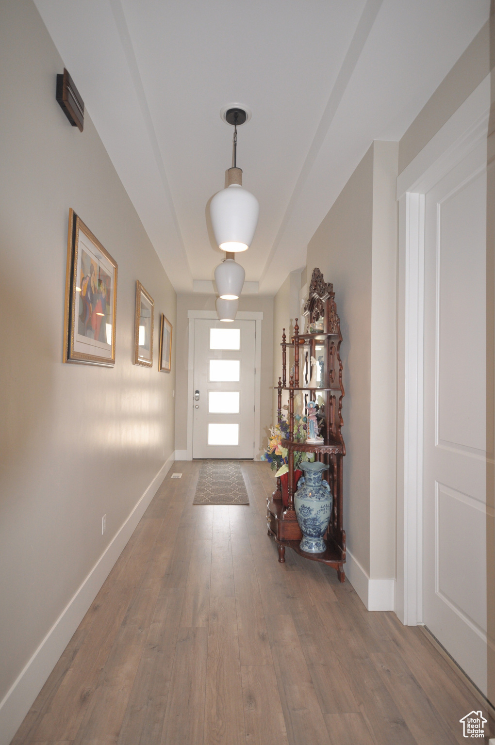 Hallway with dark wood-type flooring