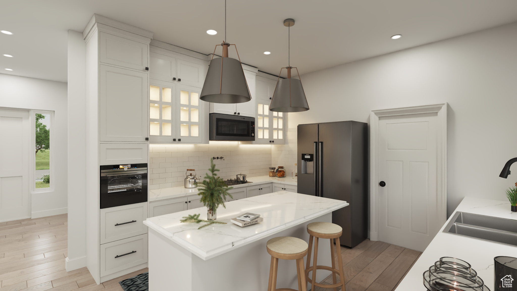 Kitchen featuring white cabinets, tasteful backsplash, black appliances, a kitchen island, and light wood-type flooring