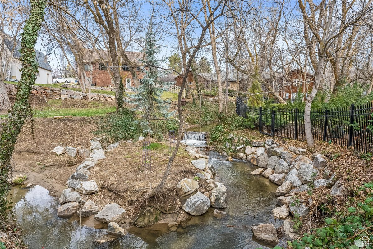 View of yard featuring the creek