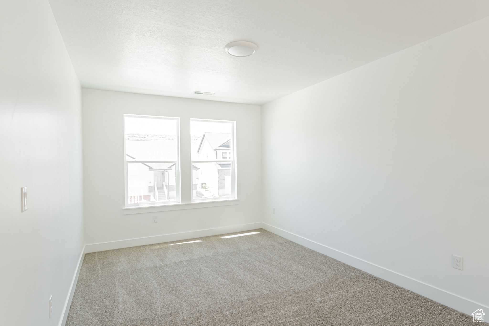 Empty room featuring carpet